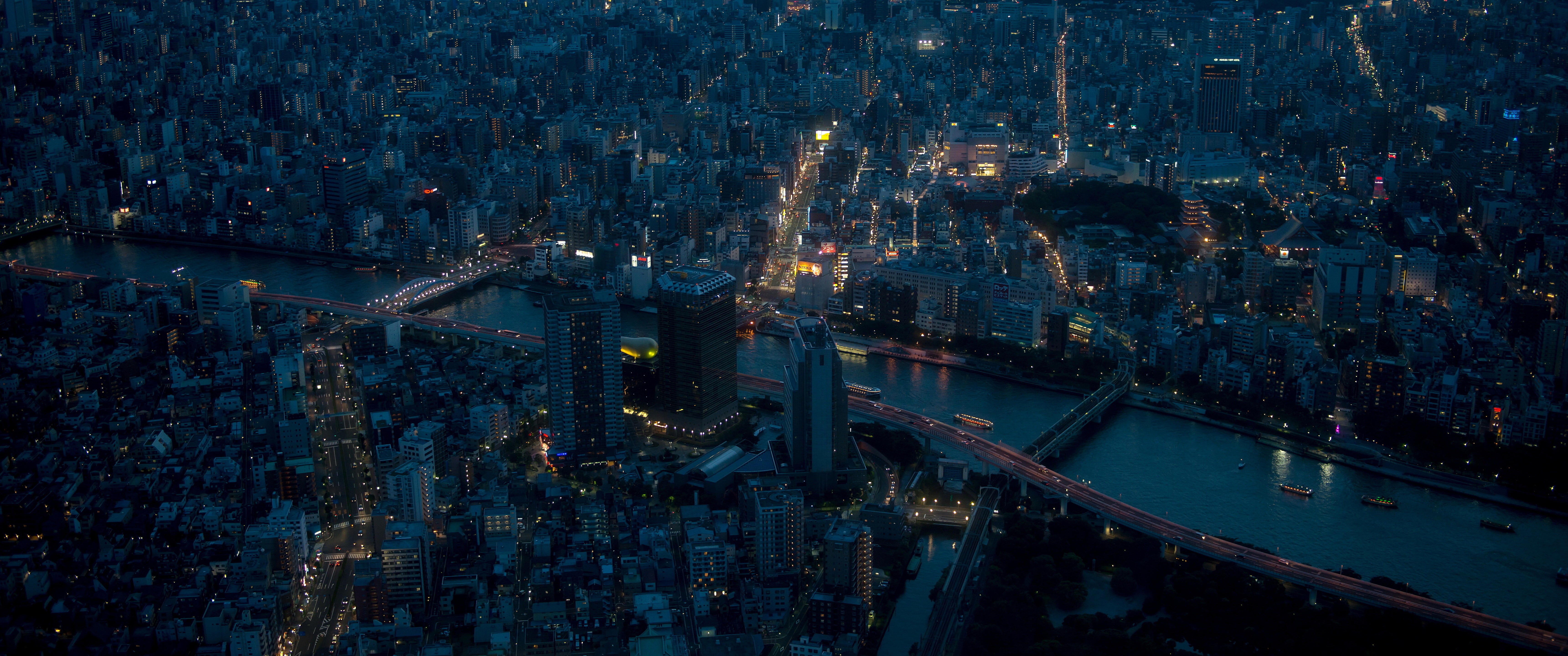 Aerial view of Tokyo at night with a river HD Wallpaper