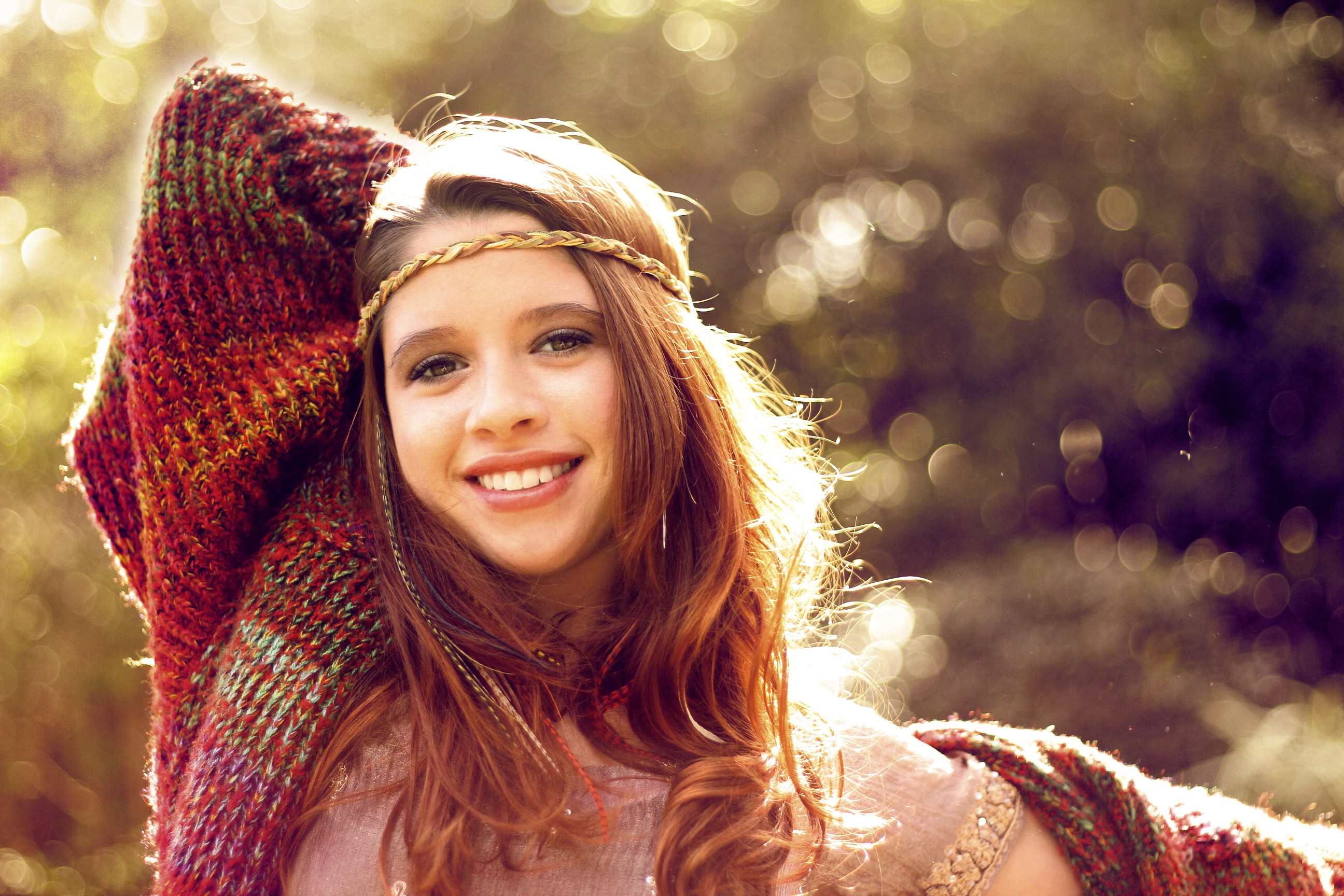 Woman with a knitted shawl and headband smiling HD Wallpaper