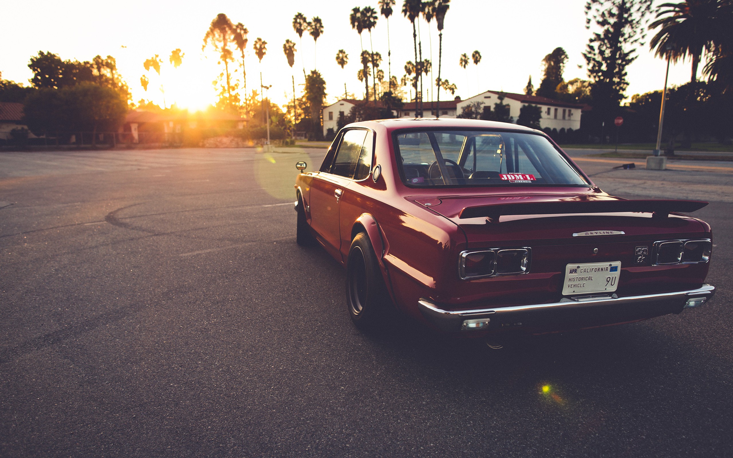 Red Nissan Skyline GT-R parked at sunset HD Wallpaper