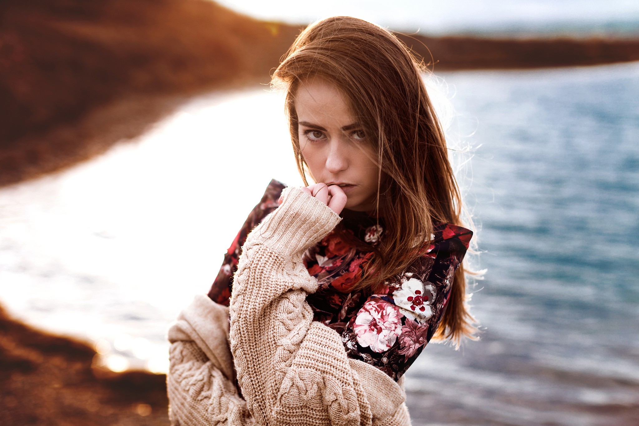 Woman with long brown hair by the water HD Wallpaper