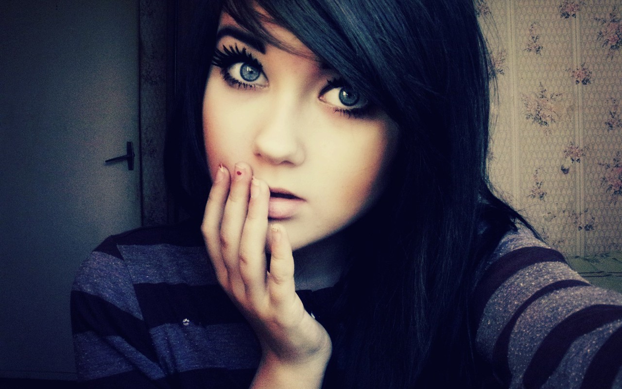 Young woman with dark hair and blue eyes HD Wallpaper