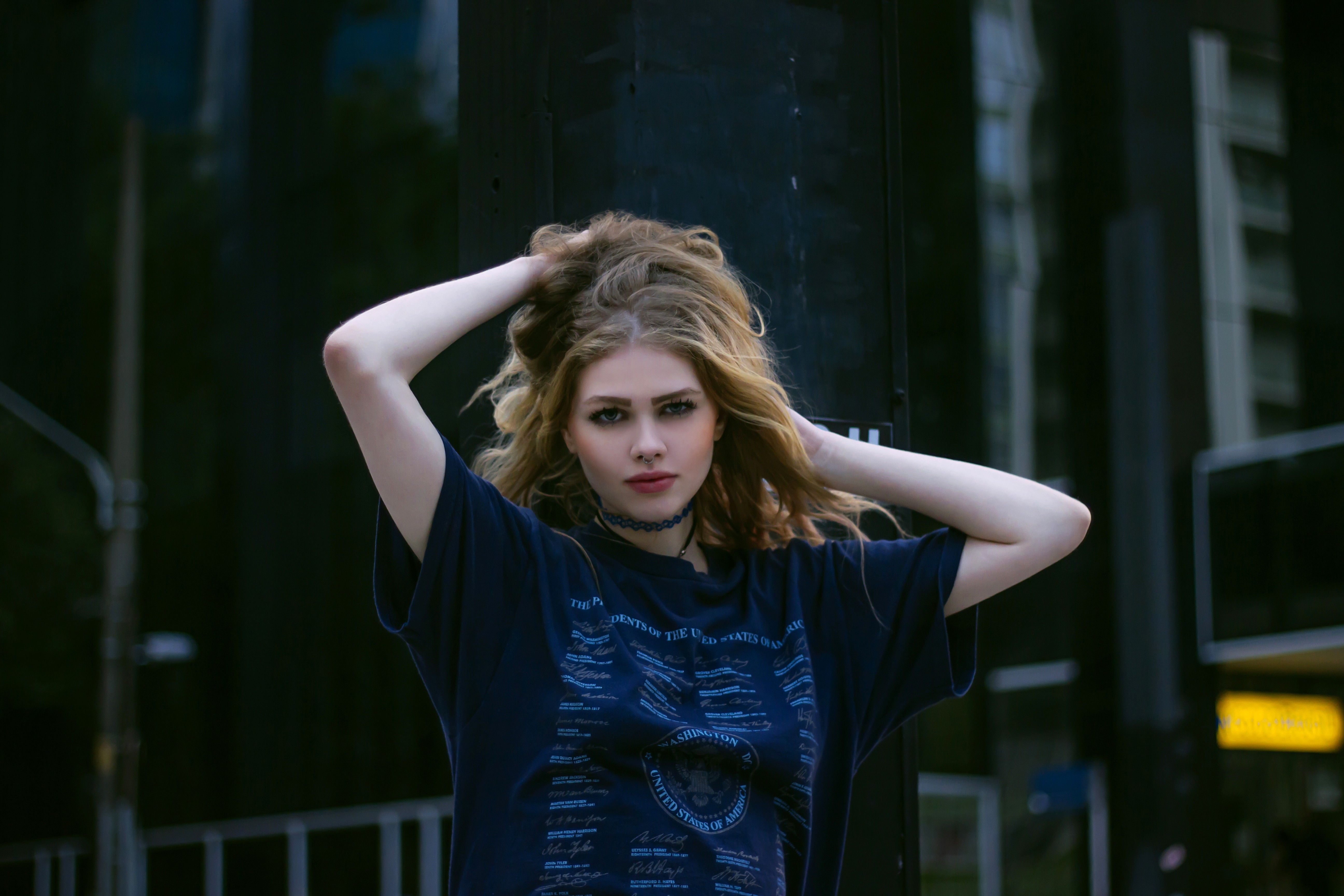 Woman with hands in hair wearing a T-shirt HD Wallpaper