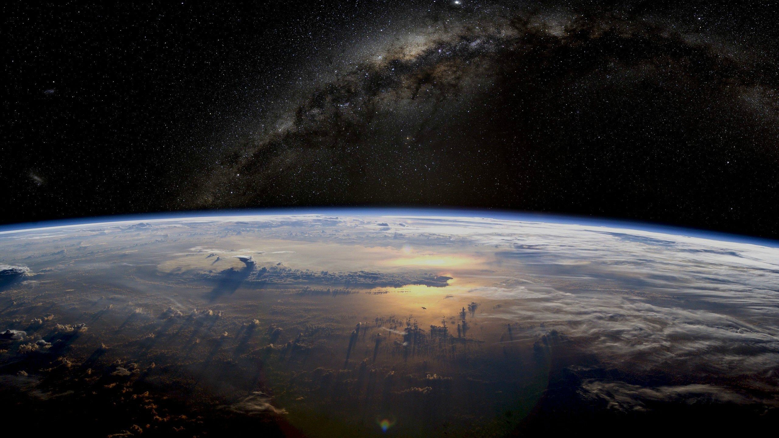 Earth and the Milky Way galaxy from space HD Wallpaper