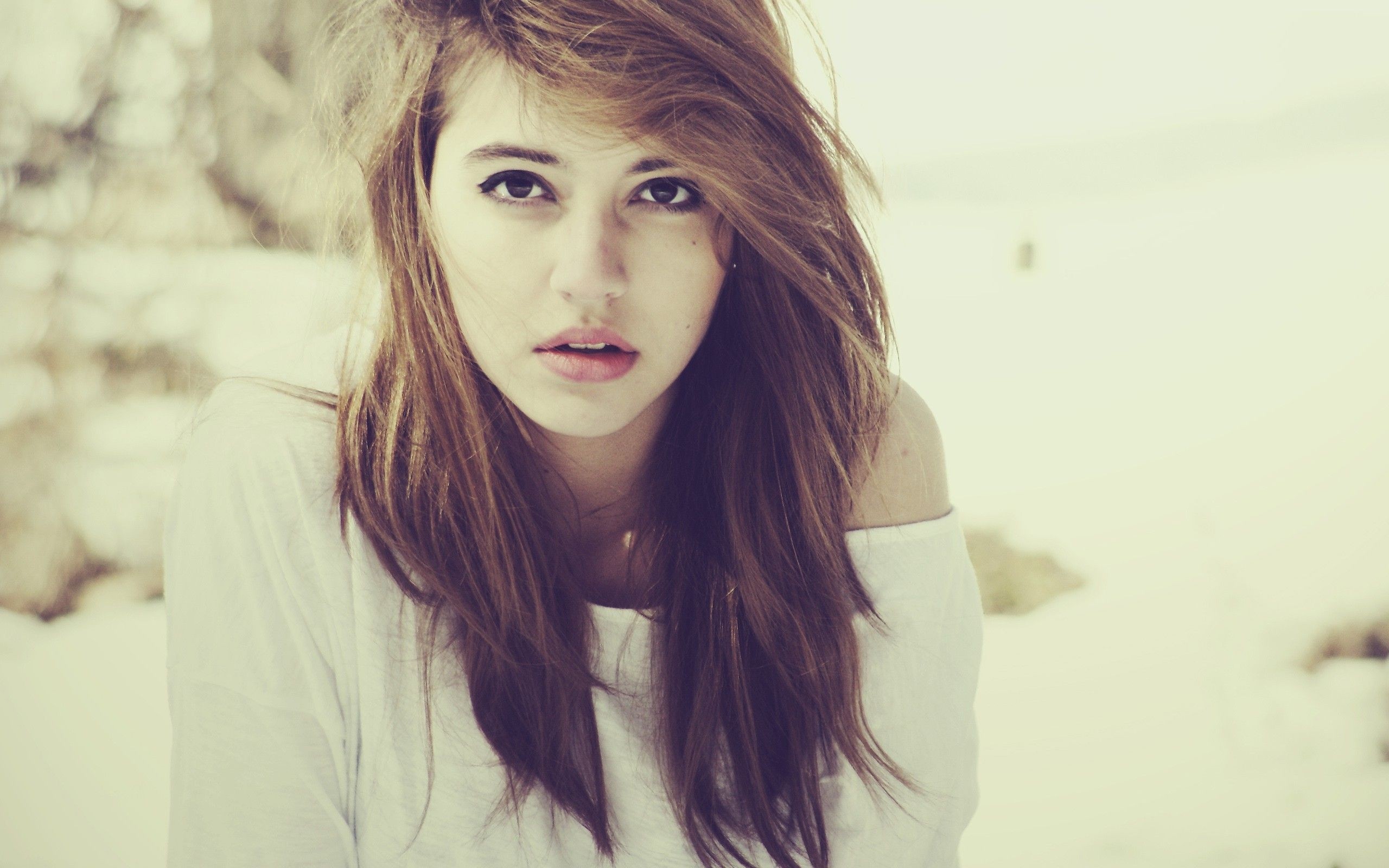 Woman with long brown hair looking at the camera HD Wallpaper