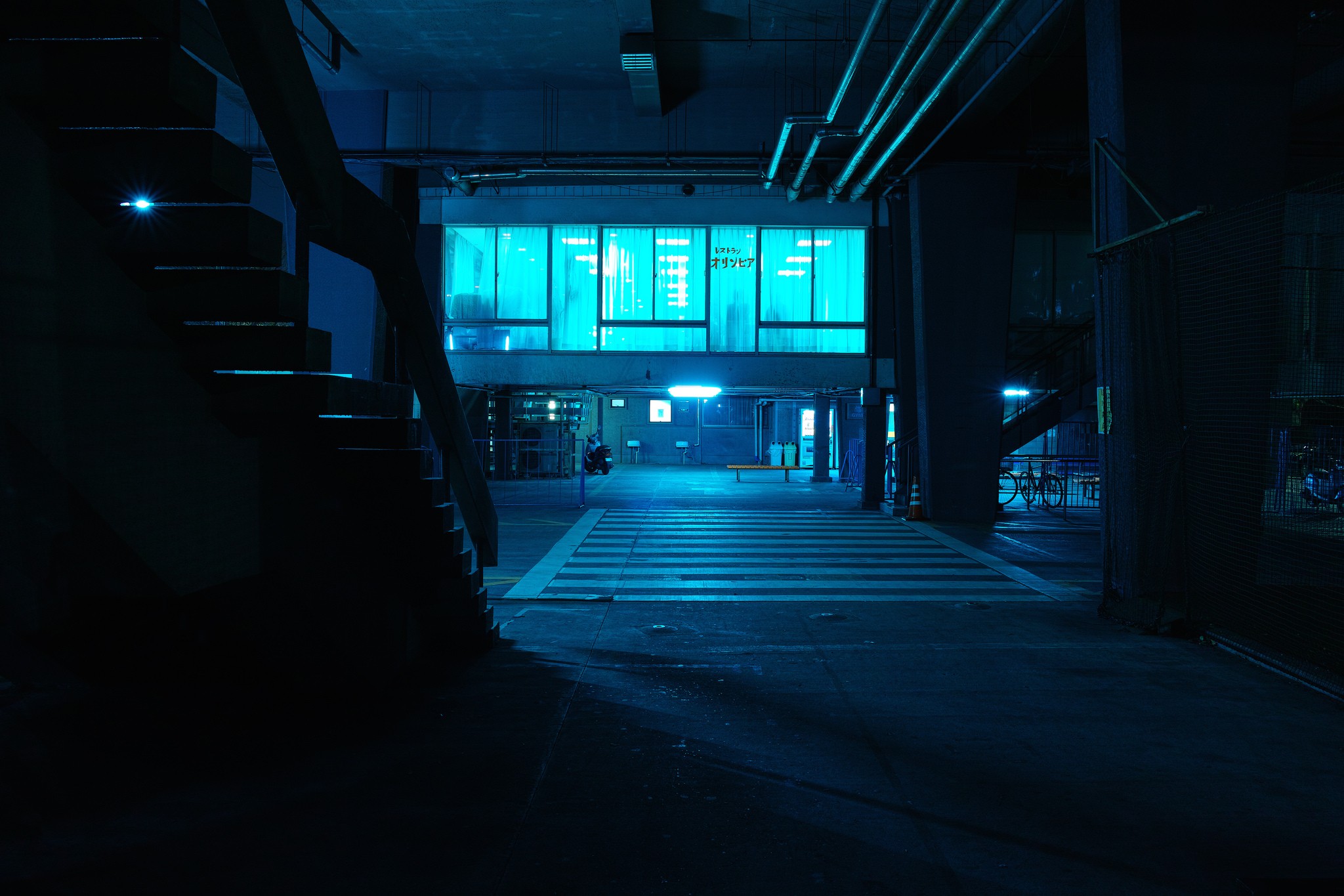 Blue lit urban underpass with stairs and crosswalk HD Wallpaper