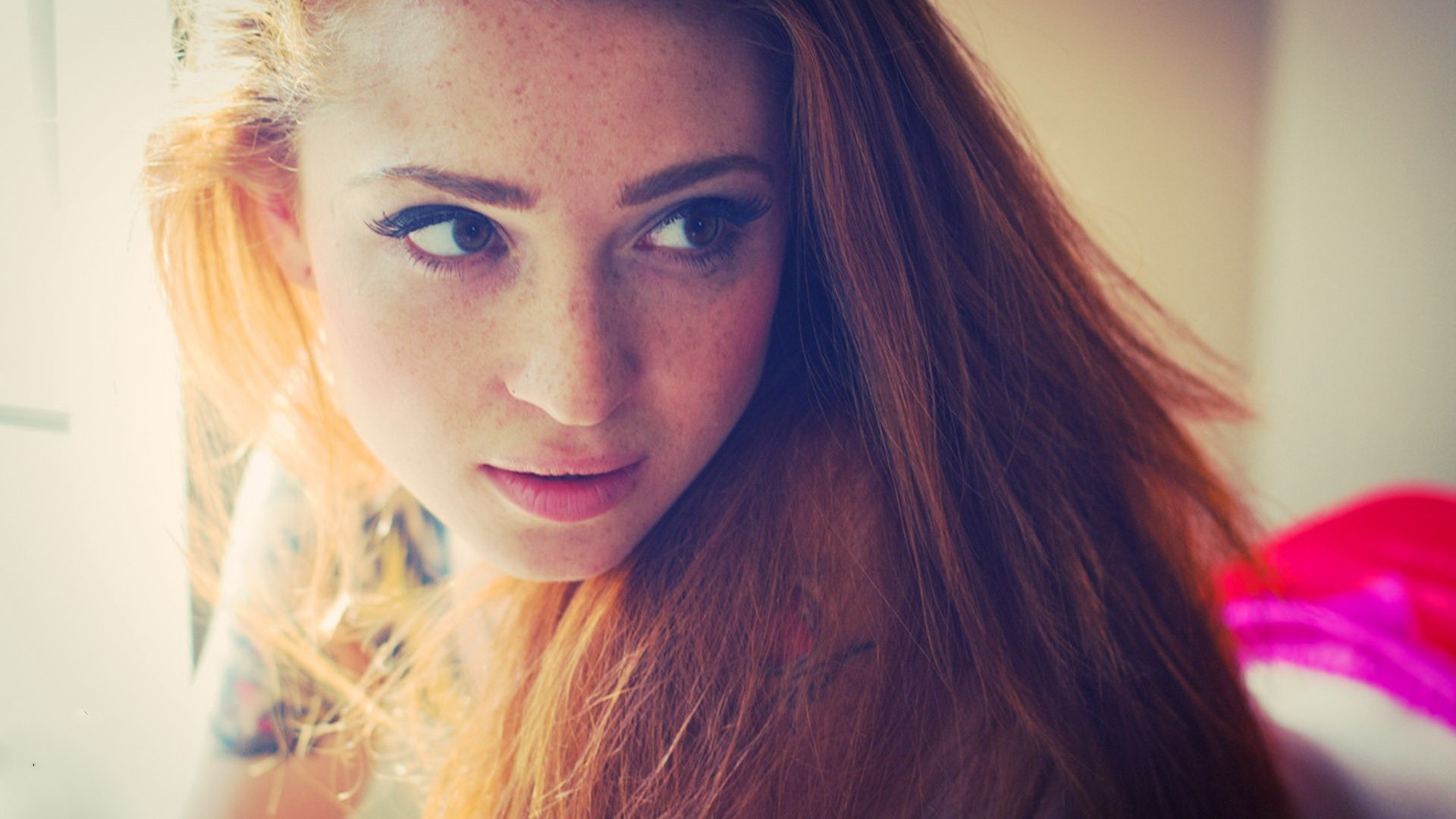 Redhead woman with freckles looking away HD Wallpaper