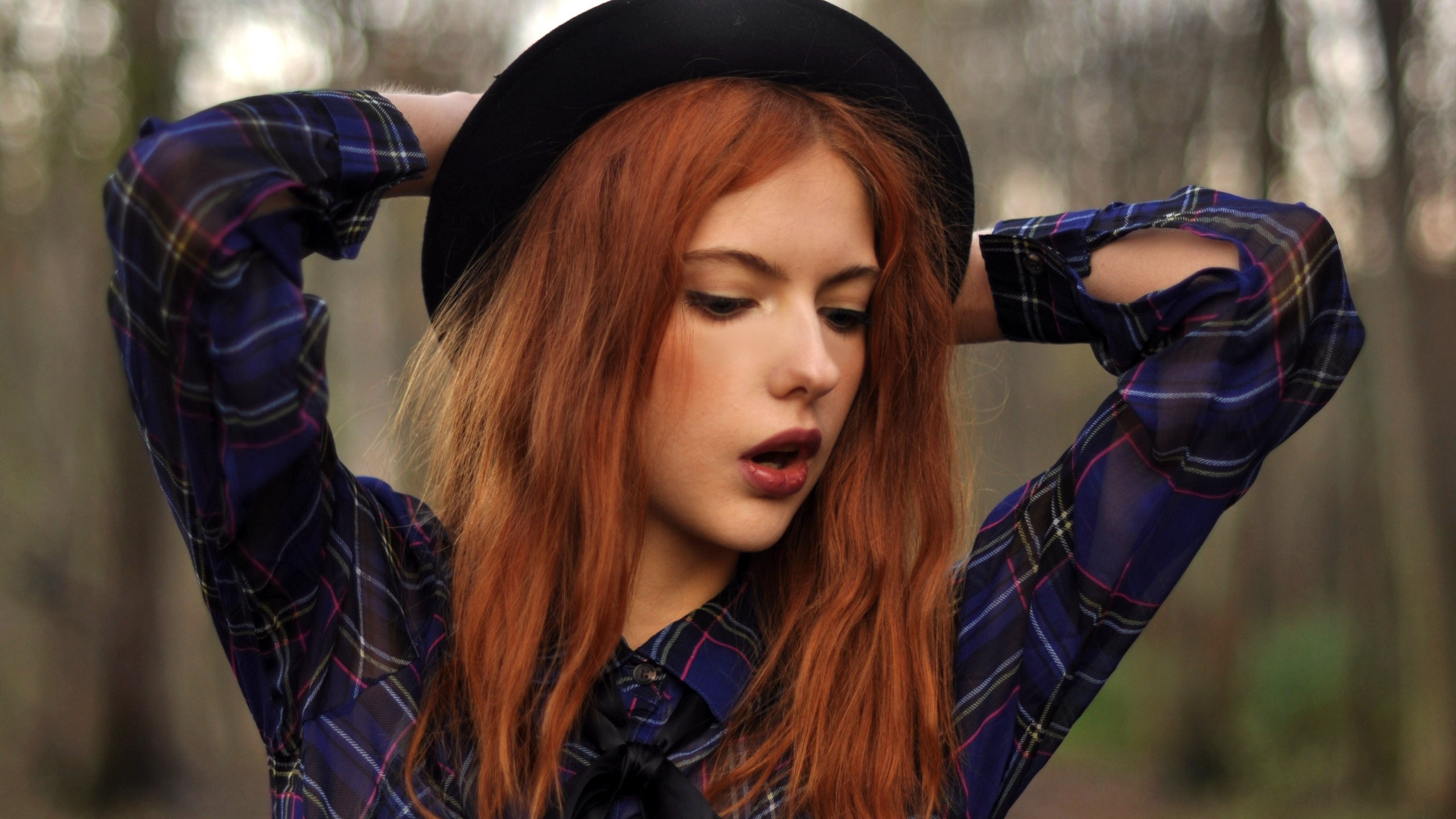 Redhead woman with arms up wearing a plaid shirt and hat HD Wallpaper
