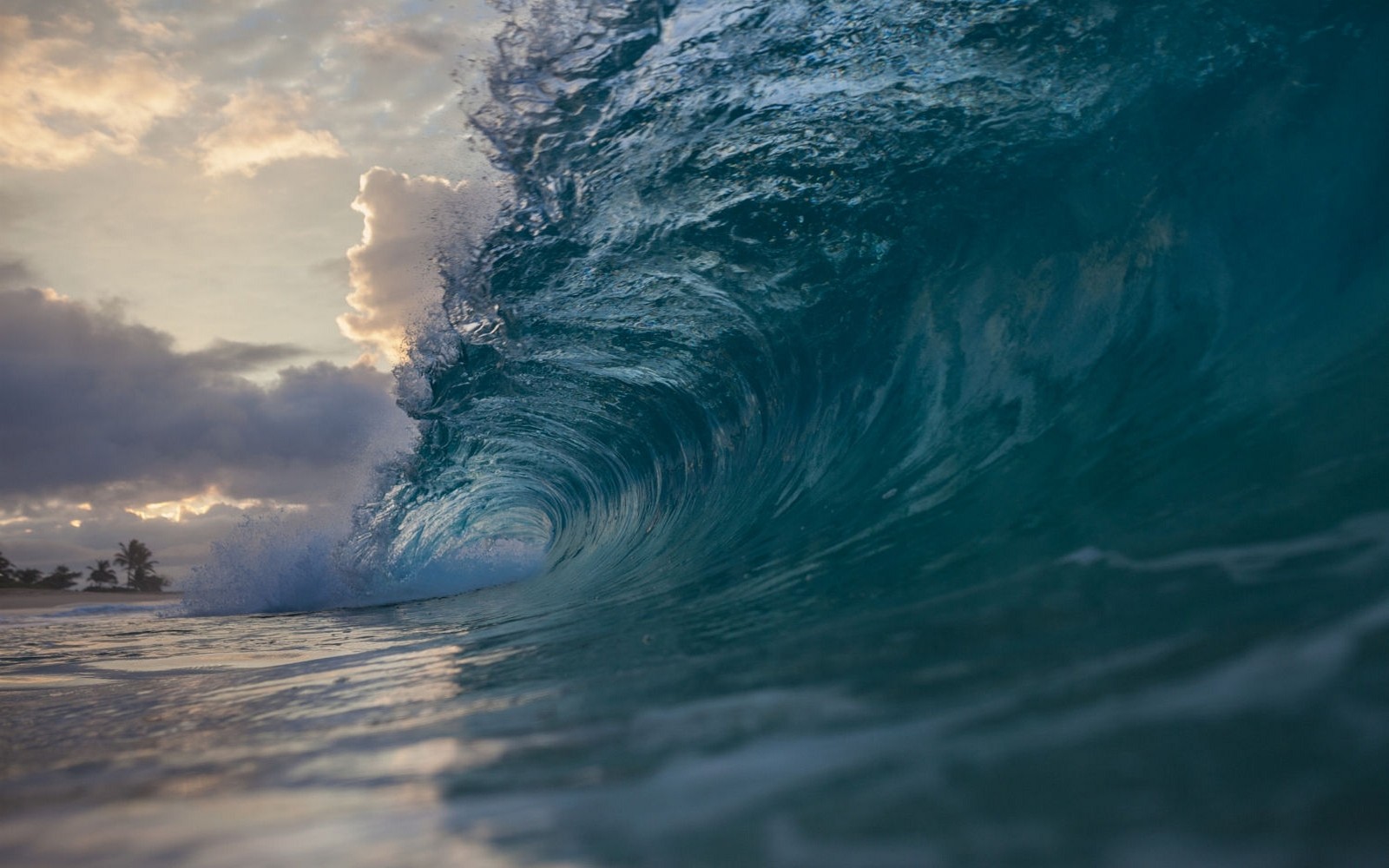 Ocean wave barrel at sunset with clouds HD Wallpaper