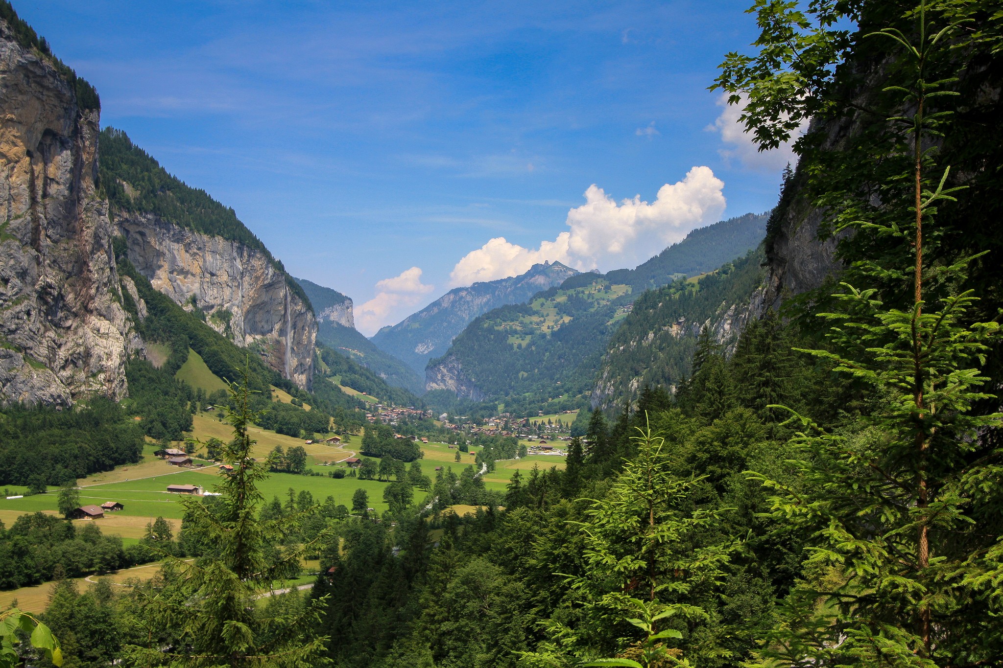 Valley with mountains and a village HD Wallpaper