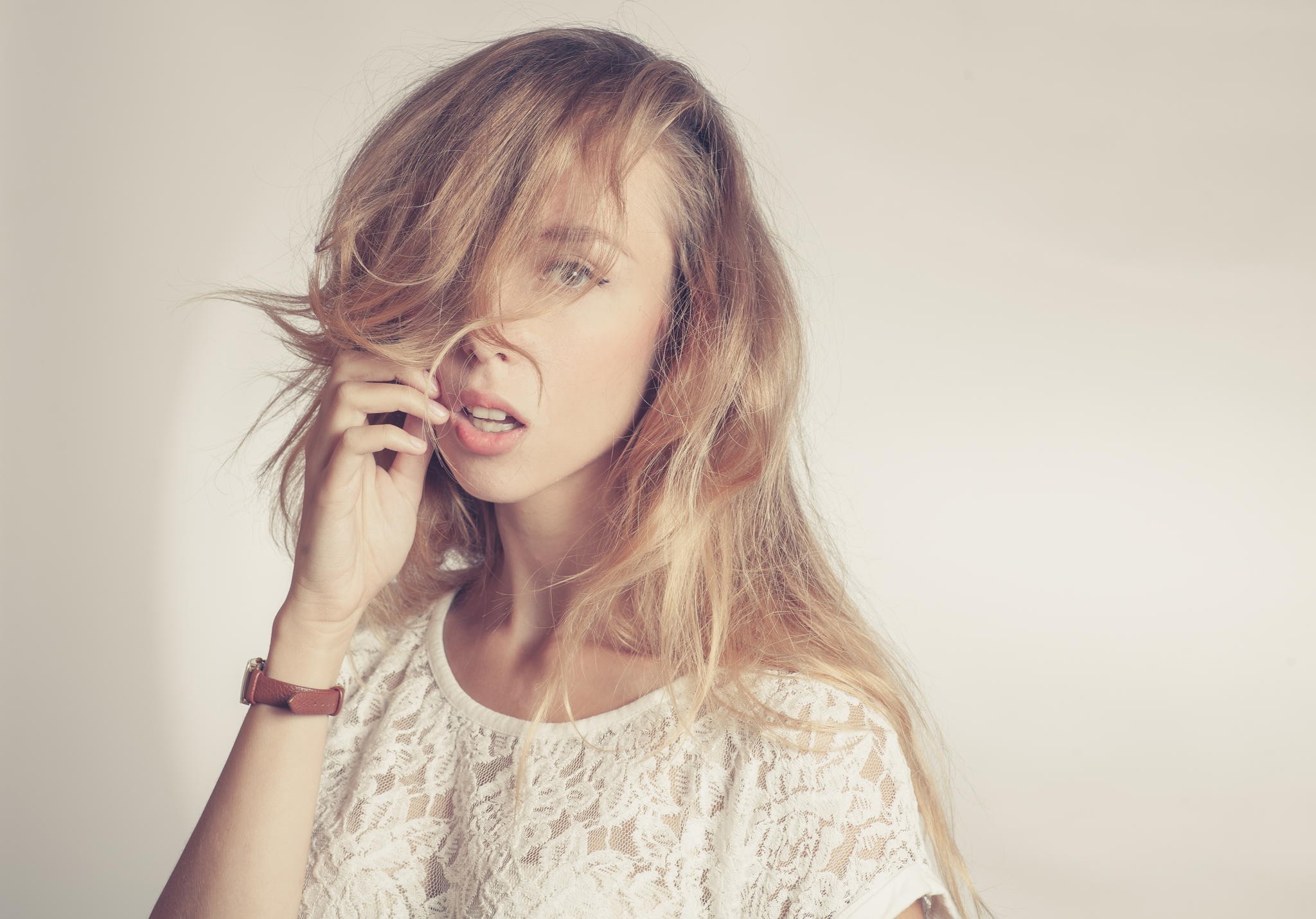 Blonde woman with hair covering face HD Wallpaper