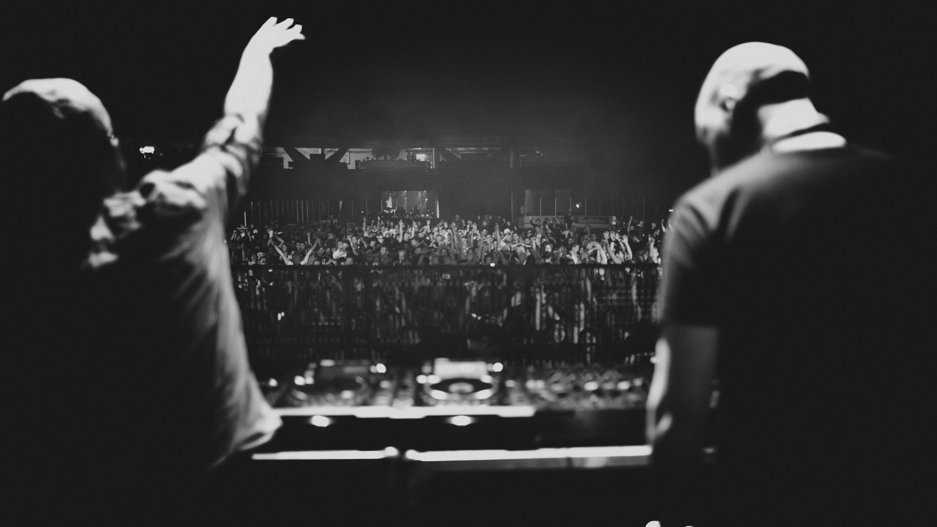 DJs performing for a crowd at a concert HD Wallpaper