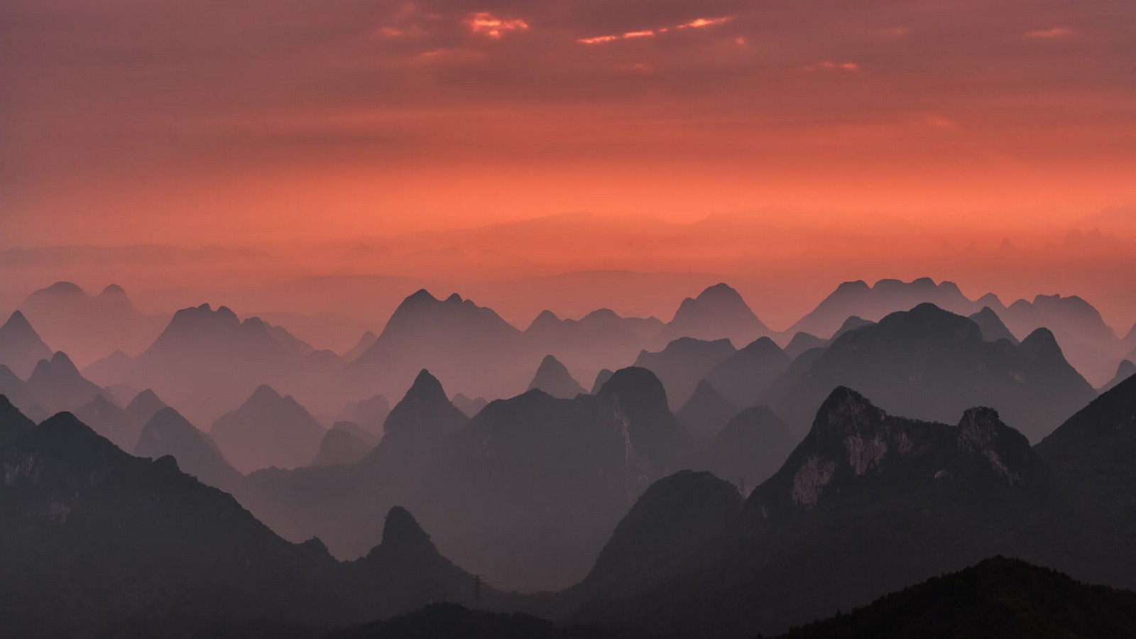Misty mountains at sunset in Guilin, China HD Wallpaper