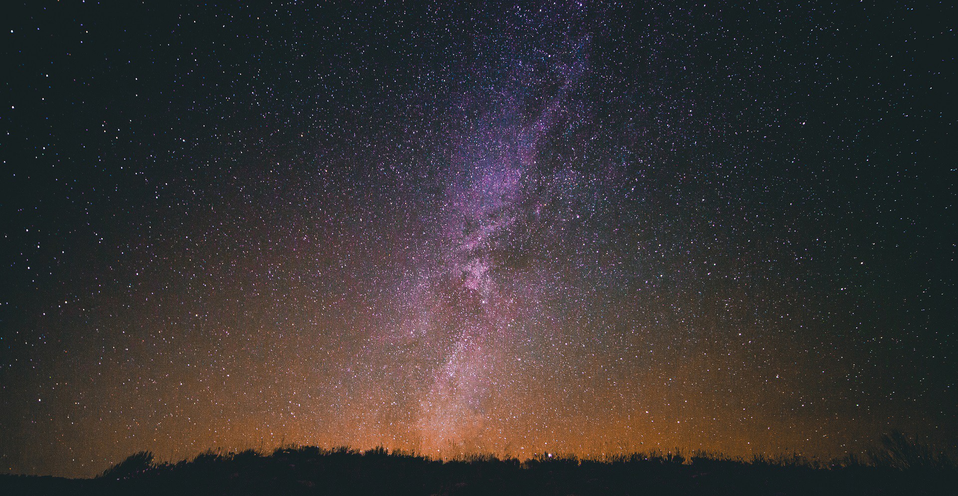 Milky Way galaxy over a dark landscape HD Wallpaper