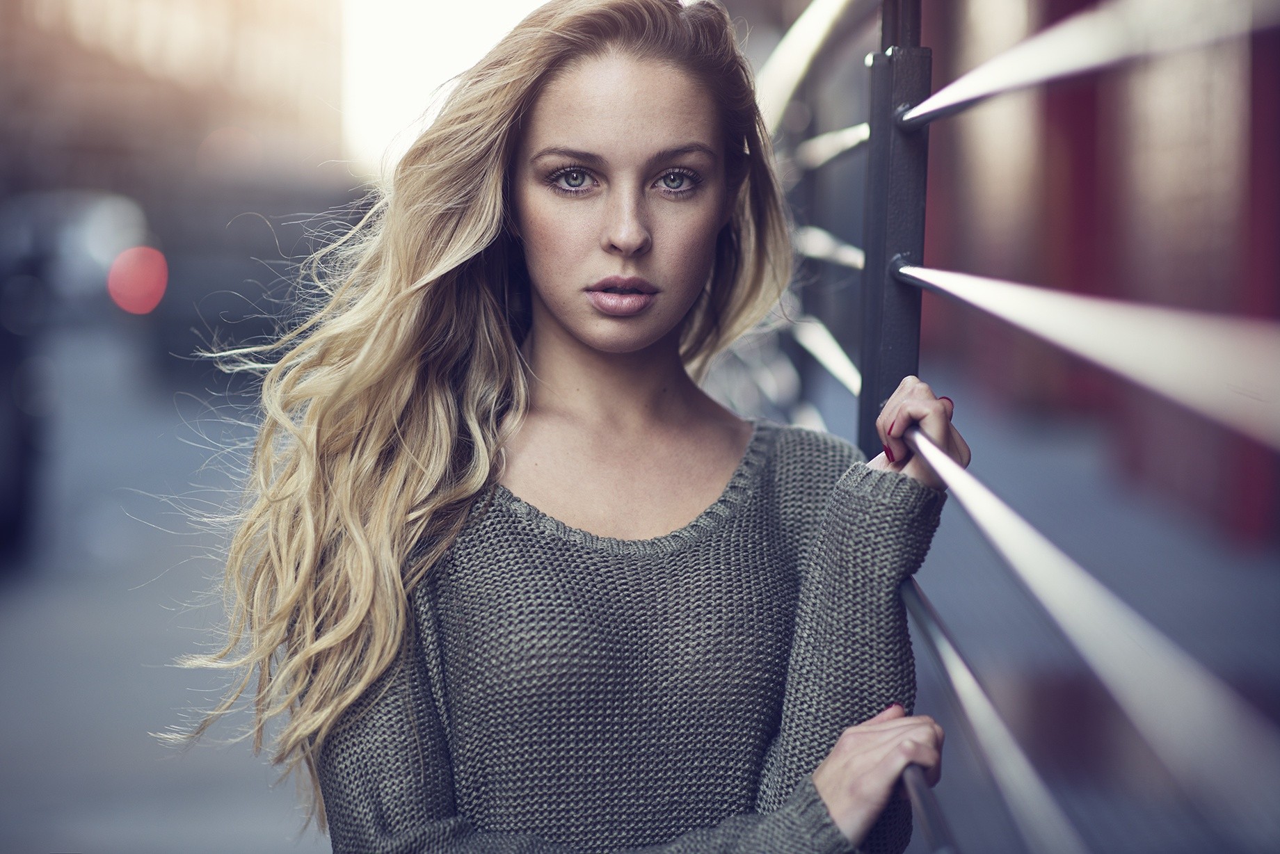 Woman with blonde hair and blue eyes wearing a sweater HD Wallpaper
