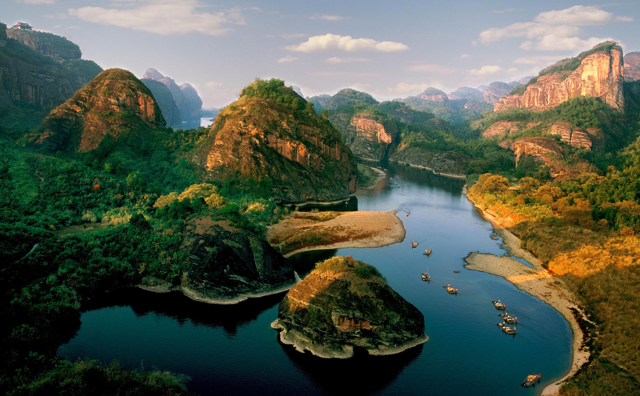 River flowing through karst mountains with boats HD Wallpaper