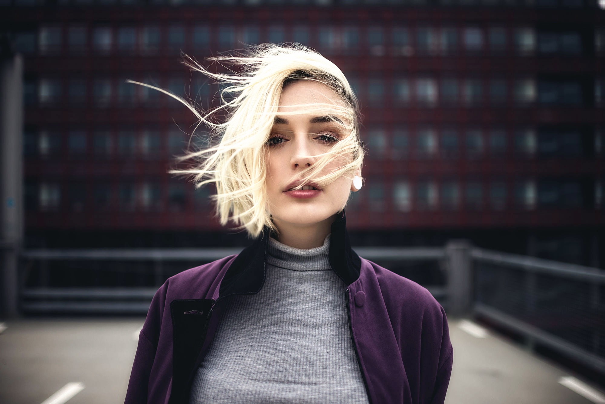 Portrait of a blonde woman with windblown hair HD Wallpaper