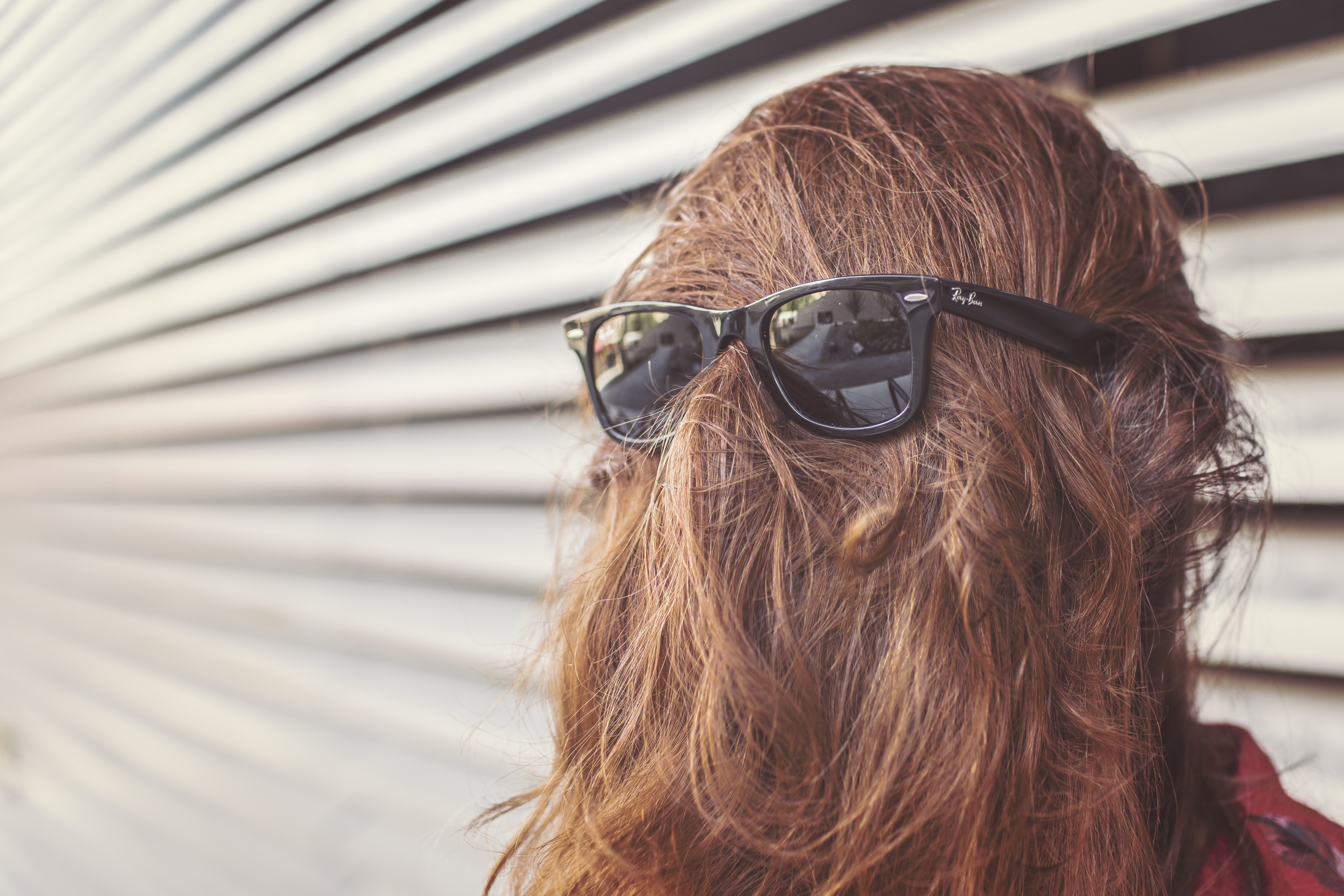 Ray-Ban sunglasses on a person's head HD Wallpaper