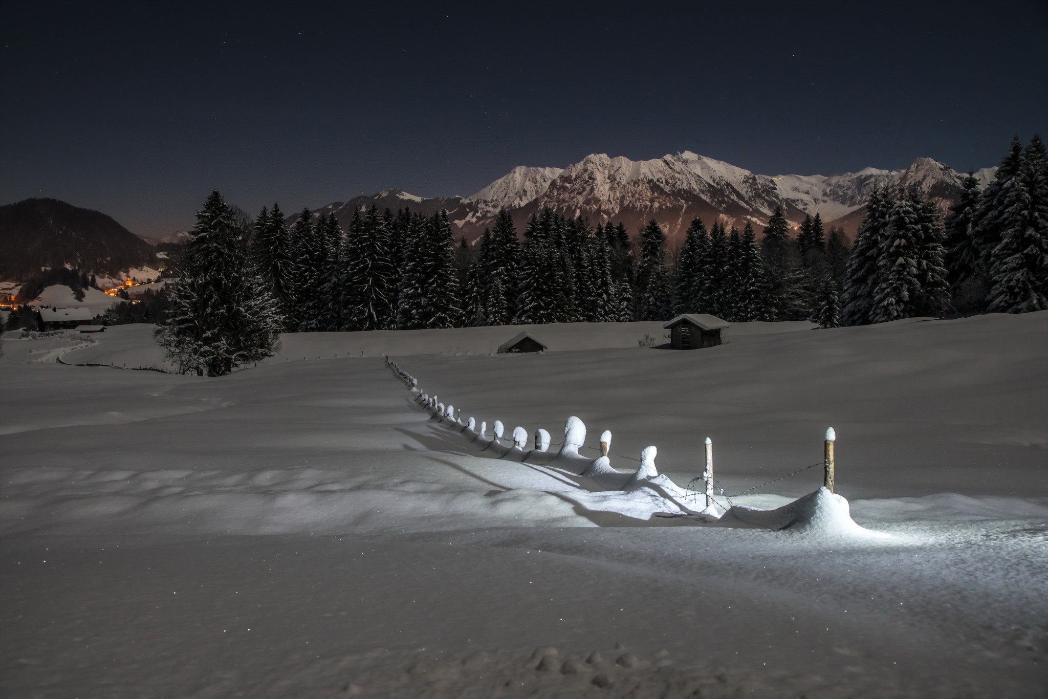 Snowy mountain landscape at night with a fence HD Wallpaper