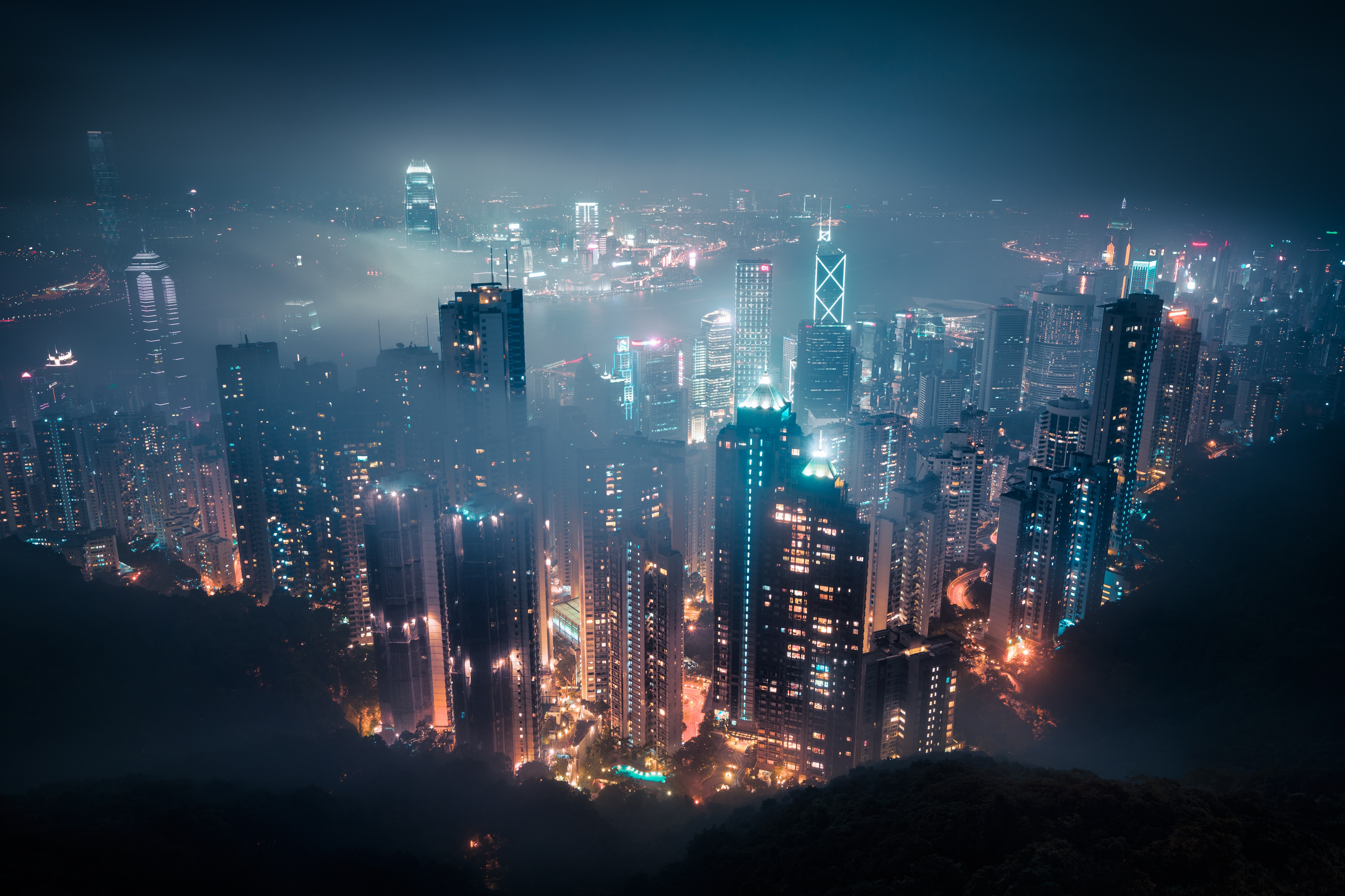 Nighttime Hong Kong cityscape shrouded in mist HD Wallpaper