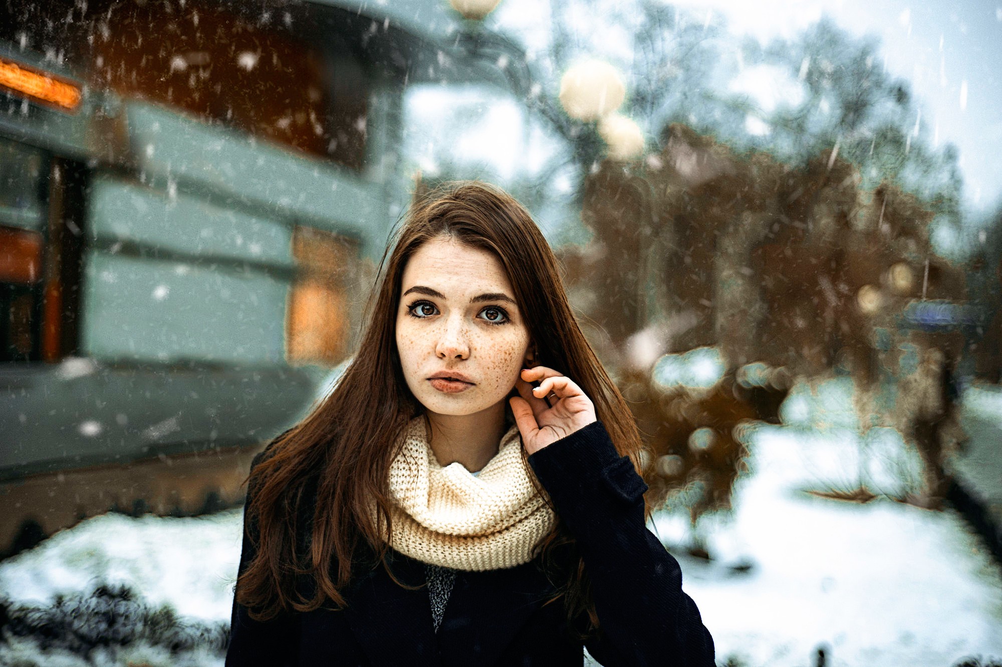 Woman with freckles in the snow HD Wallpaper