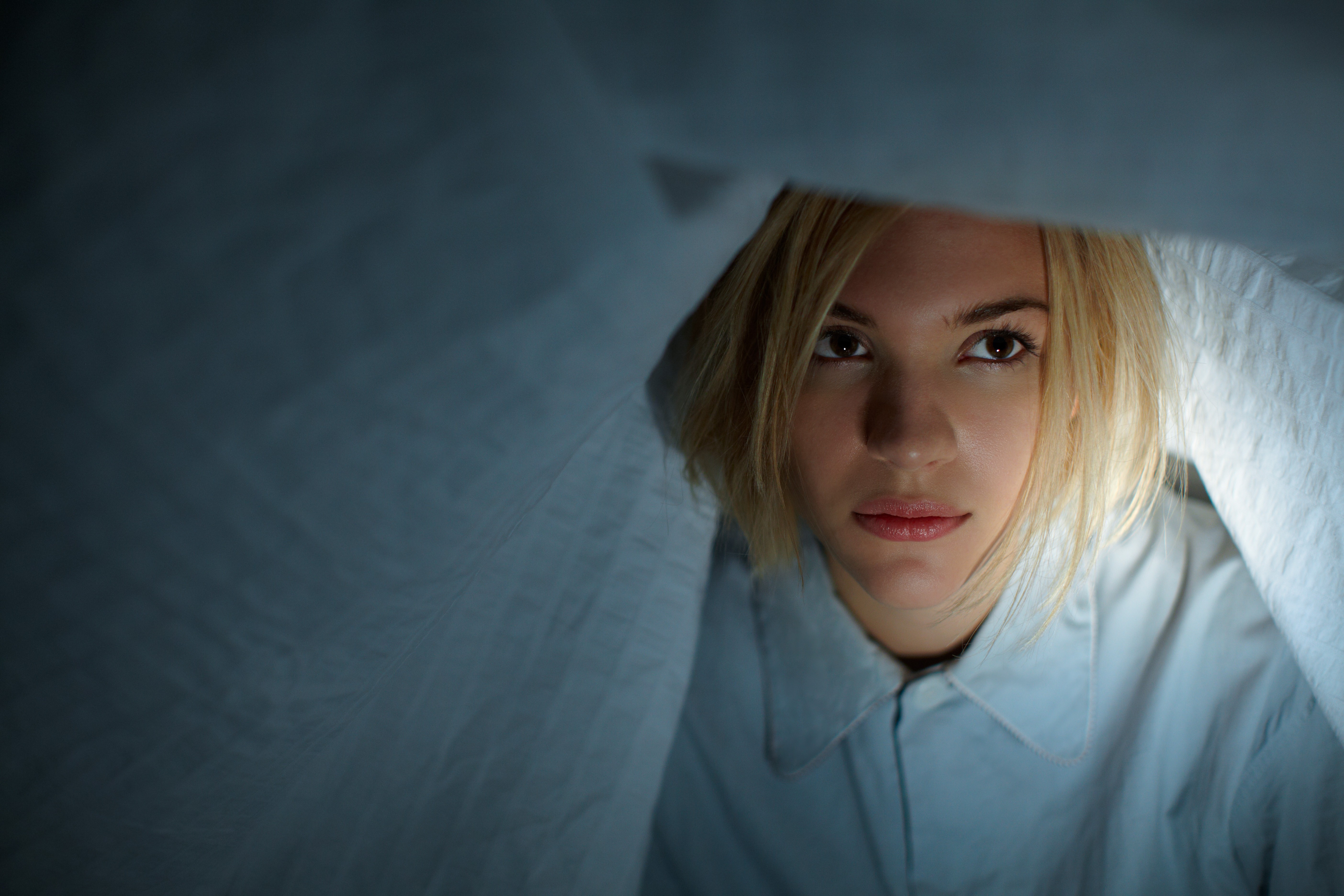 Tove Styrke peeking from under a blanket HD Wallpaper