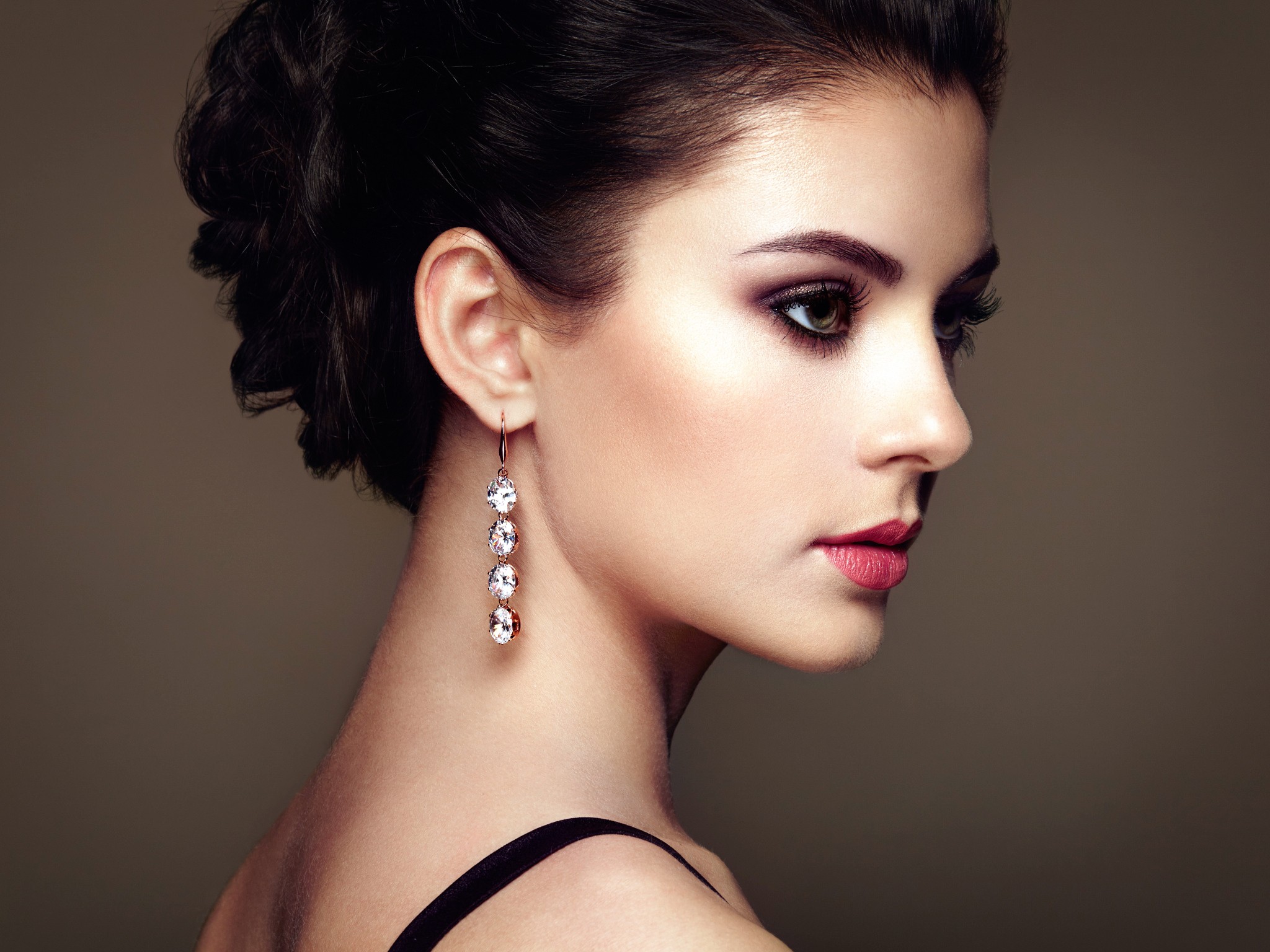 Woman with dark hair and diamond earrings HD Wallpaper