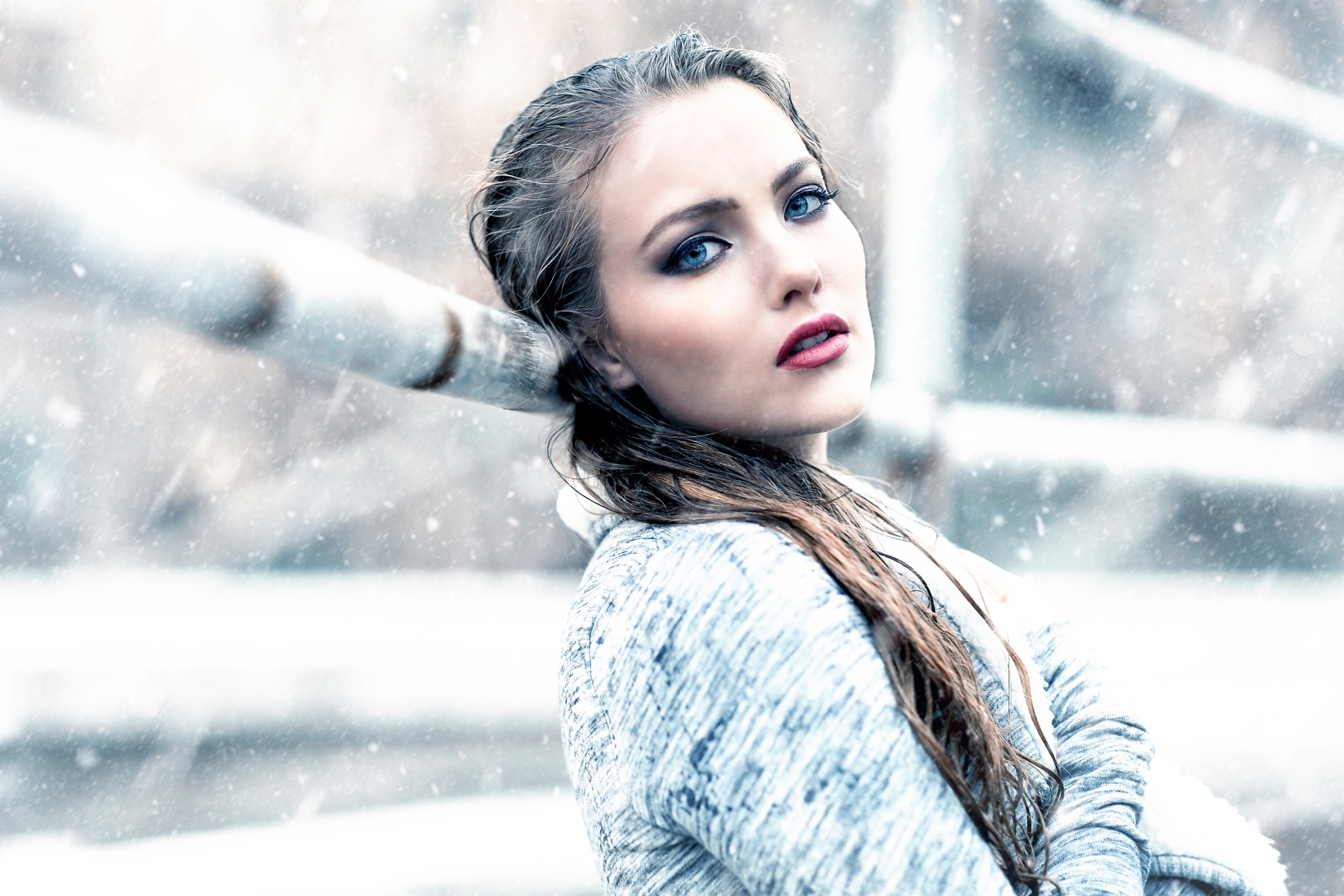 Woman with blue eyes in the snow HD Wallpaper