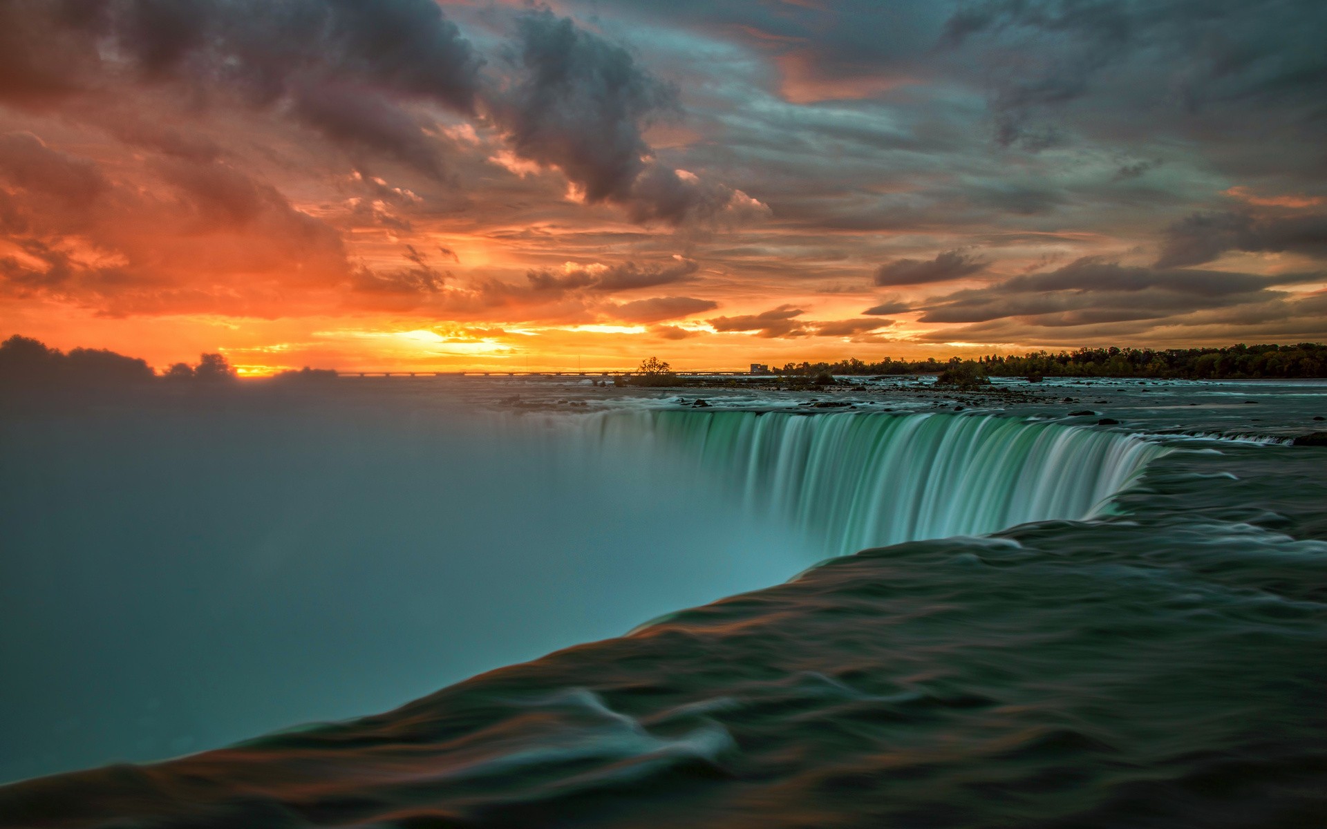 Niagara Falls at sunset with dramatic clouds HD Wallpaper