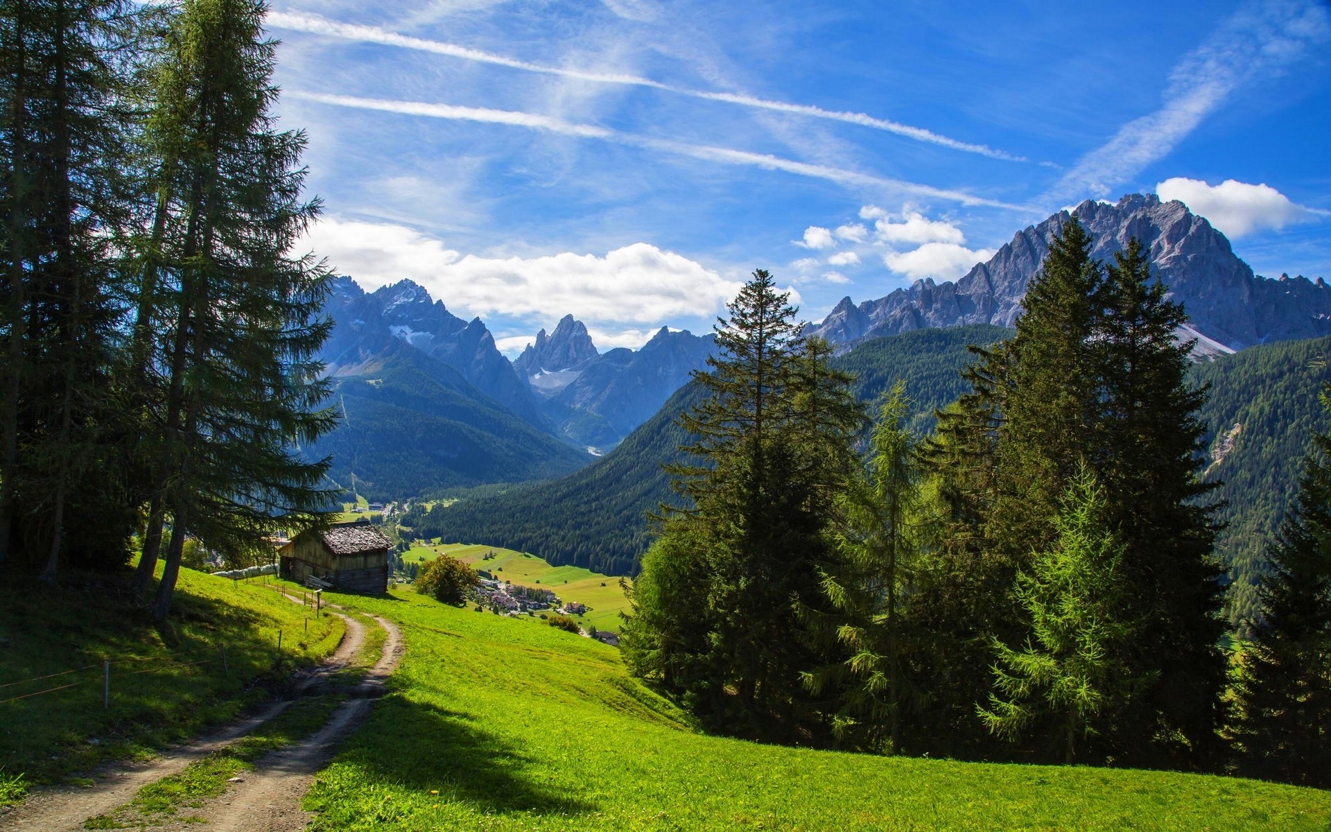 Mountain valley with a small cabin and trees HD Wallpaper