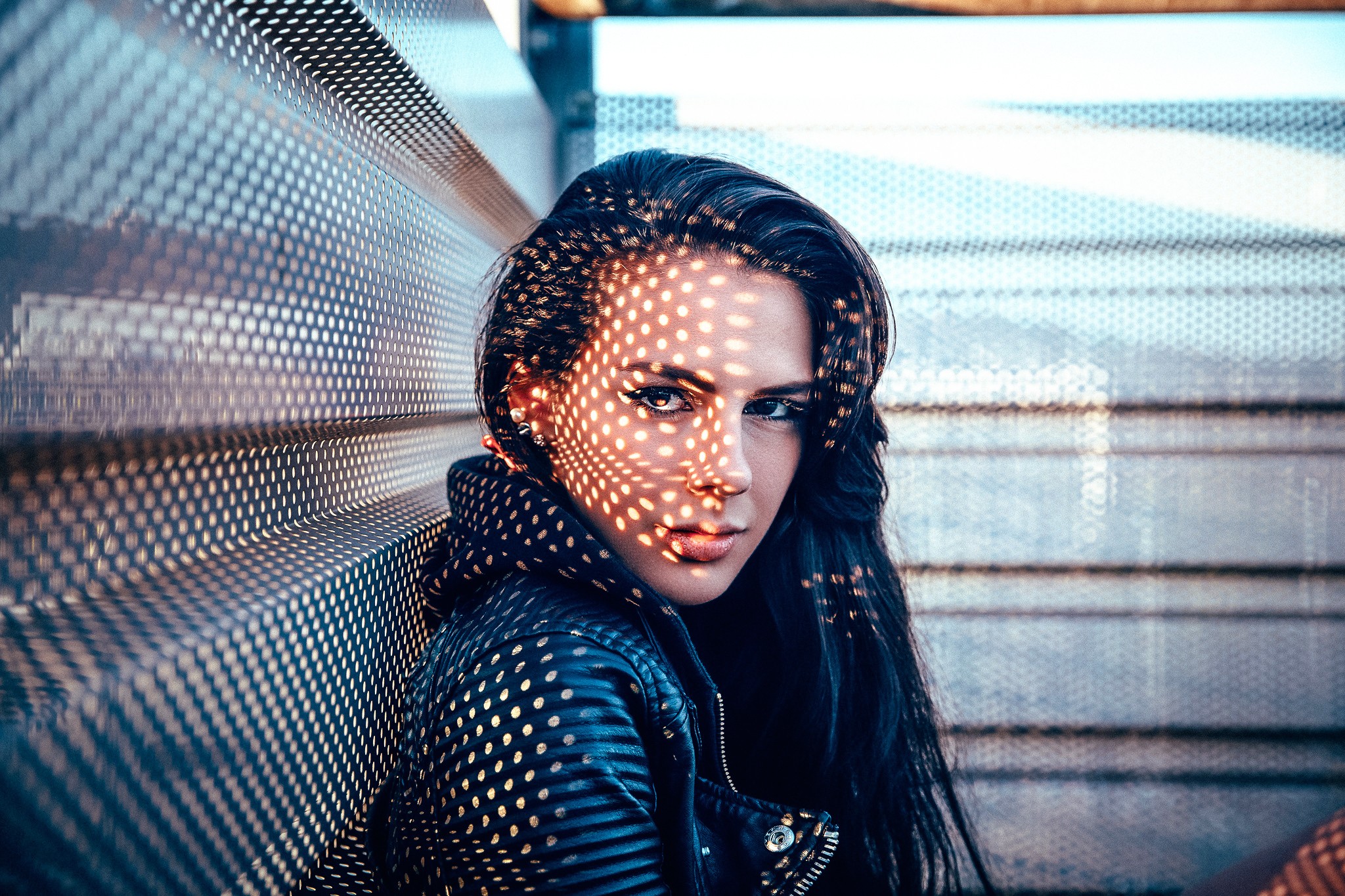 Woman with patterned light on her face HD Wallpaper