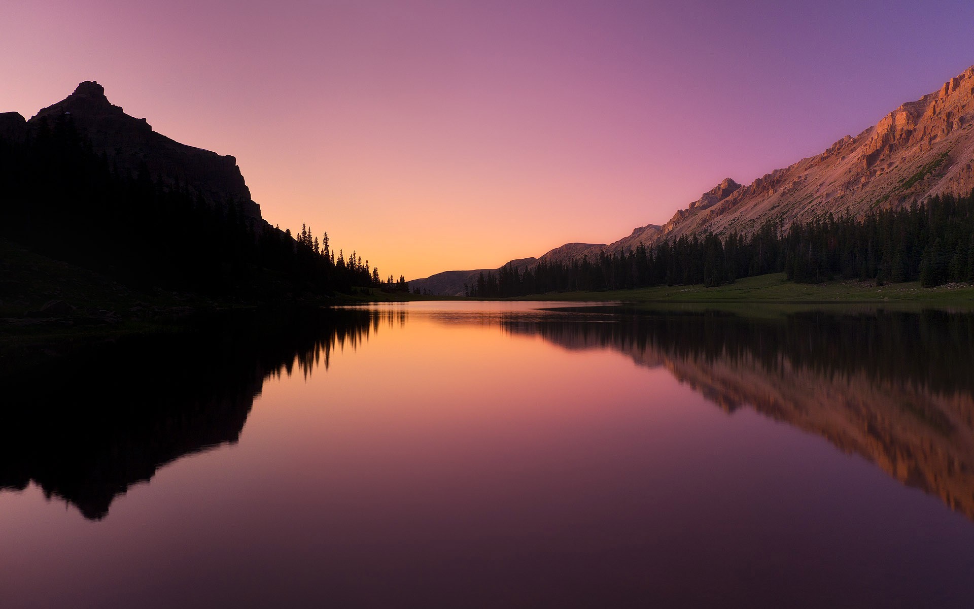 Sunset over a mountain lake with reflections HD Wallpaper