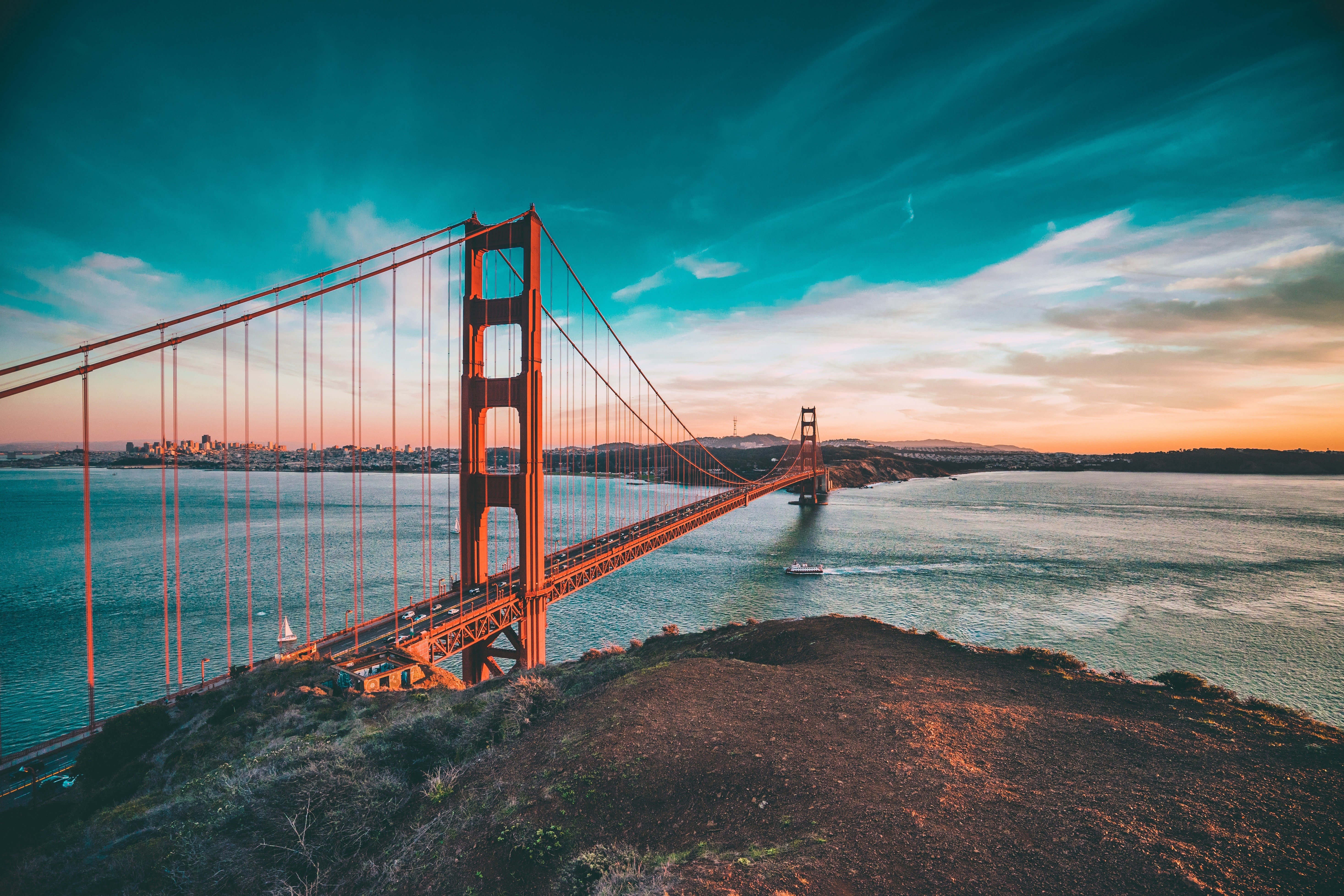 Golden Gate Bridge at sunset over the ocean HD Wallpaper