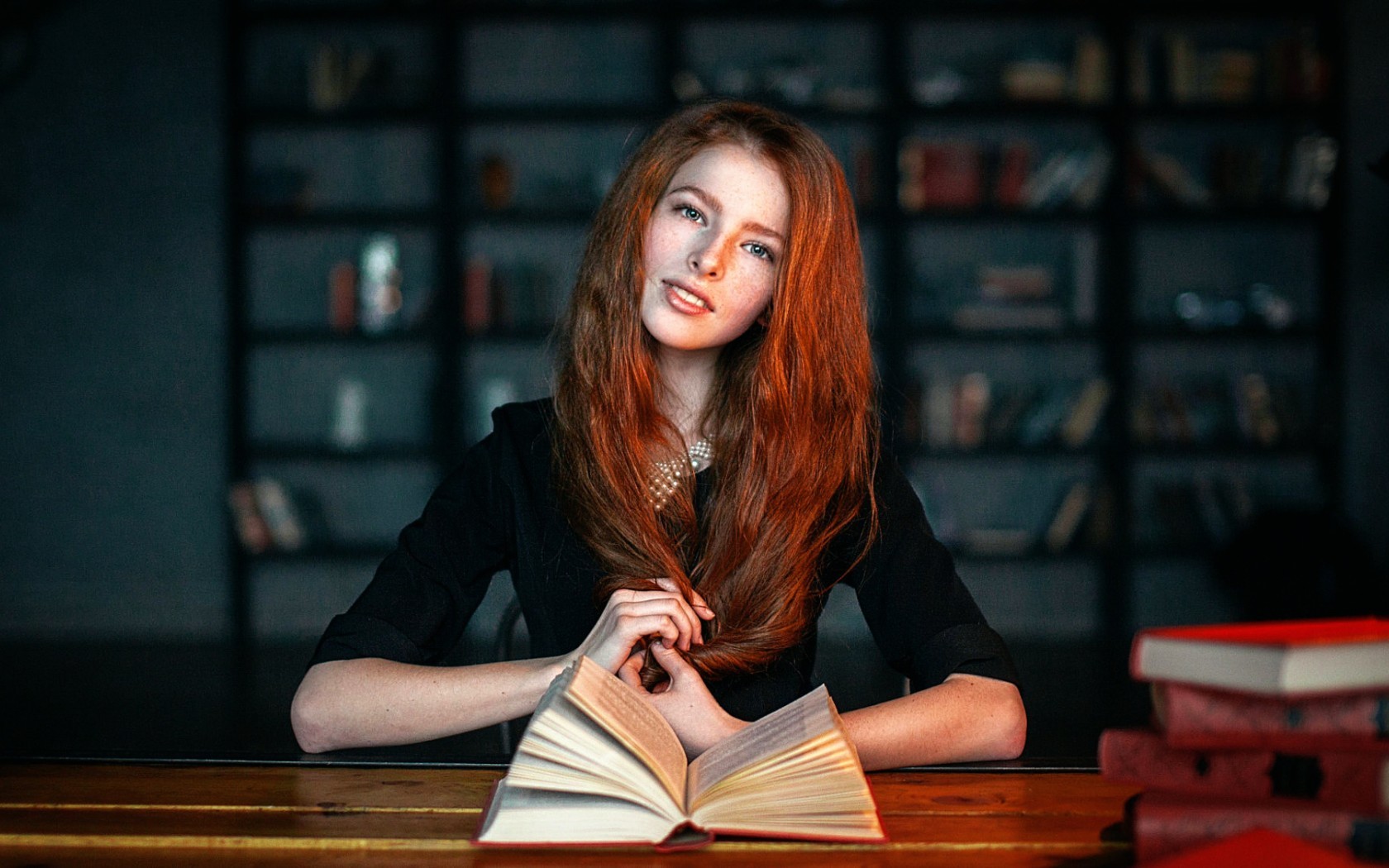 Redhead woman with books in library HD Wallpaper
