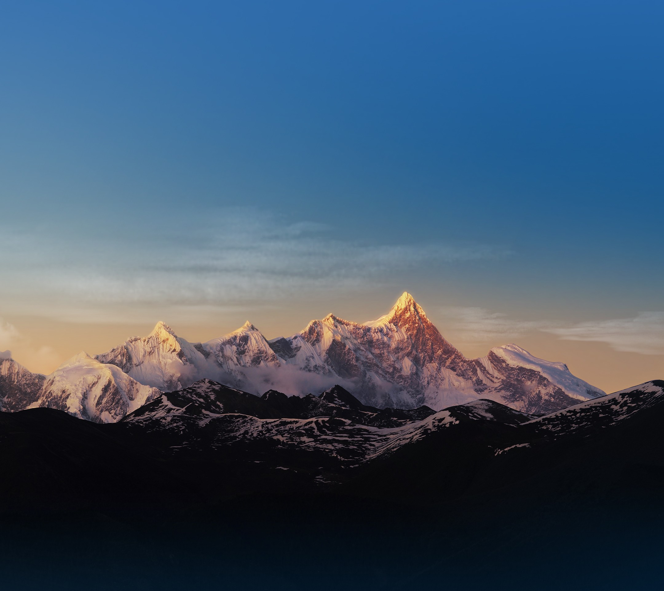Snow-capped mountains under a clear blue sky HD Wallpaper