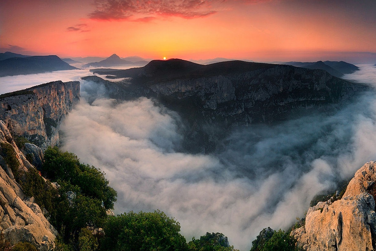 Sunset over a misty canyon in France HD Wallpaper