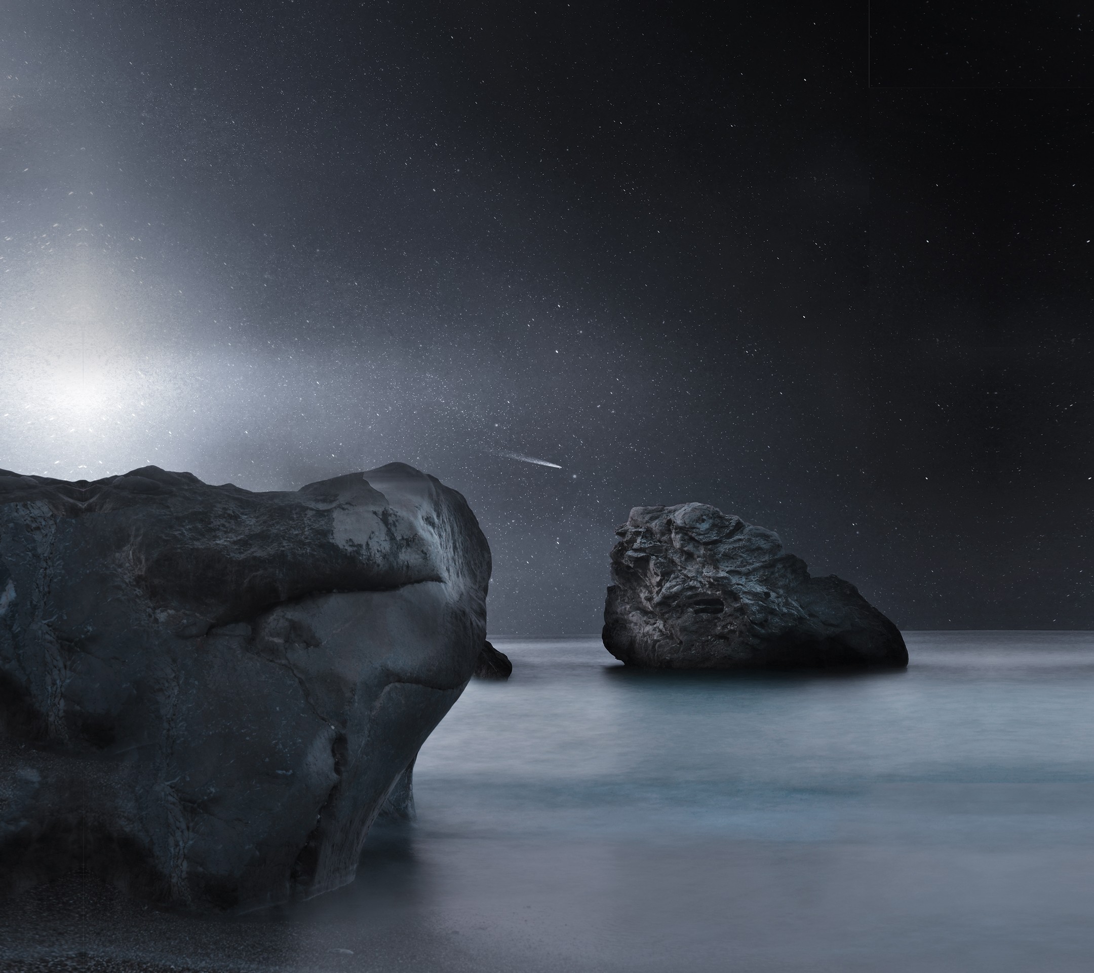 Rocks in the ocean under a starry sky HD Wallpaper