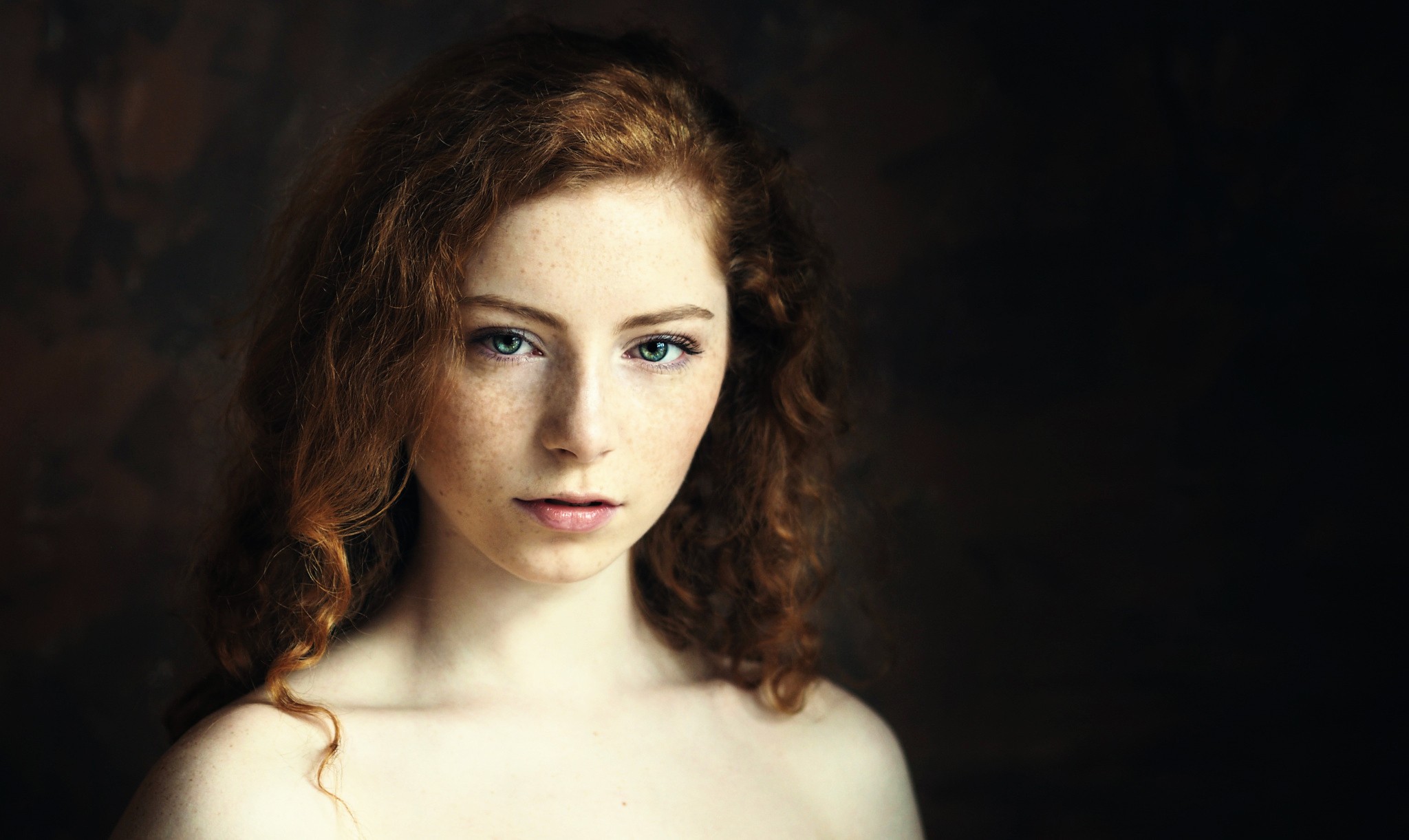 Portrait of a young woman with red hair and freckles HD Wallpaper