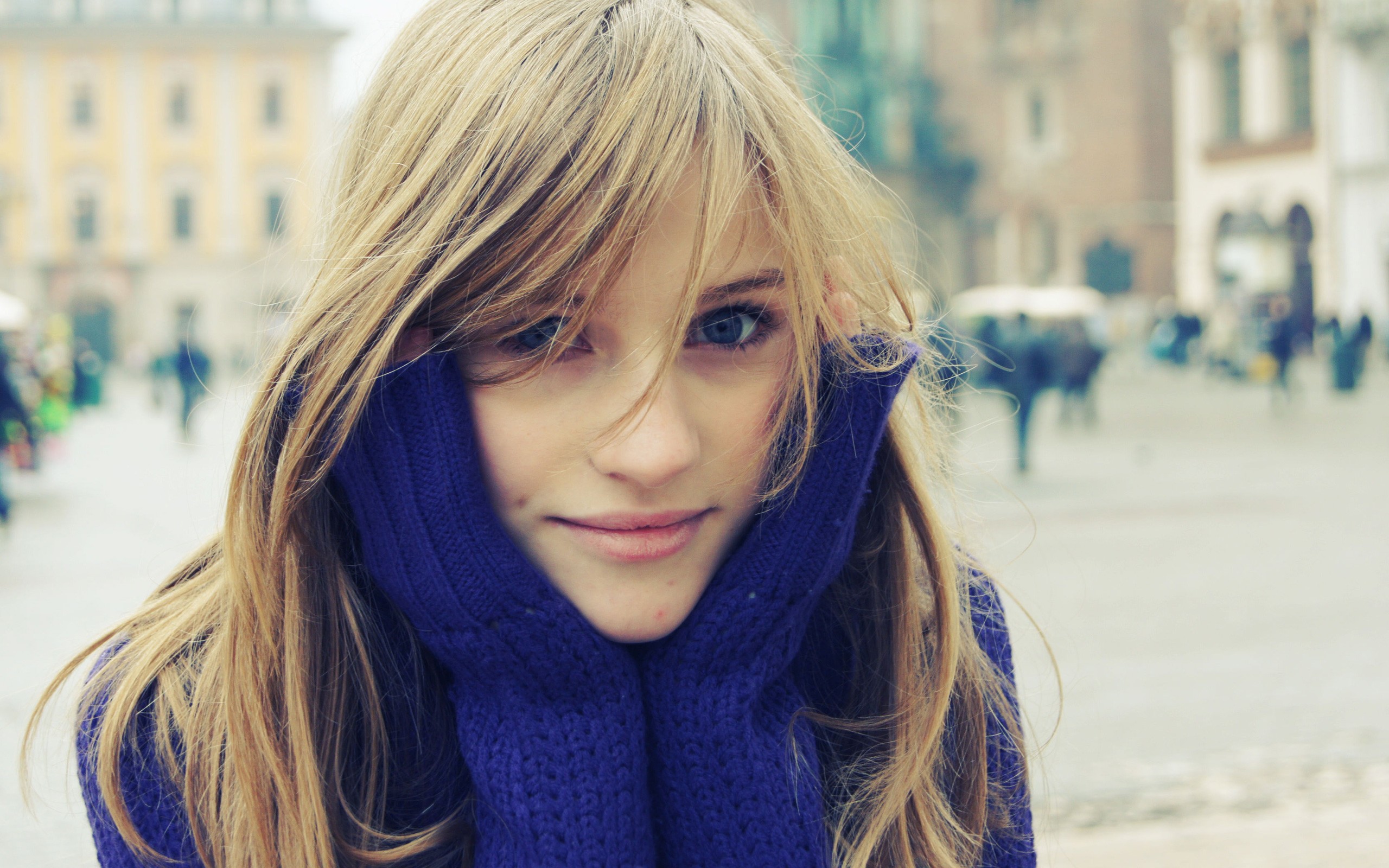 Young woman with blonde hair wearing a purple sweater HD Wallpaper