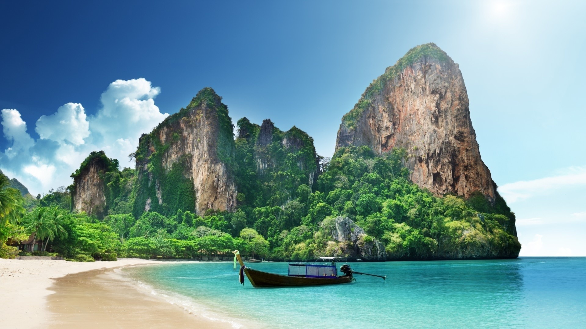 Railay Beach Krabi Thailand with Limestone Cliffs and Longtail Boat HD Wallpaper