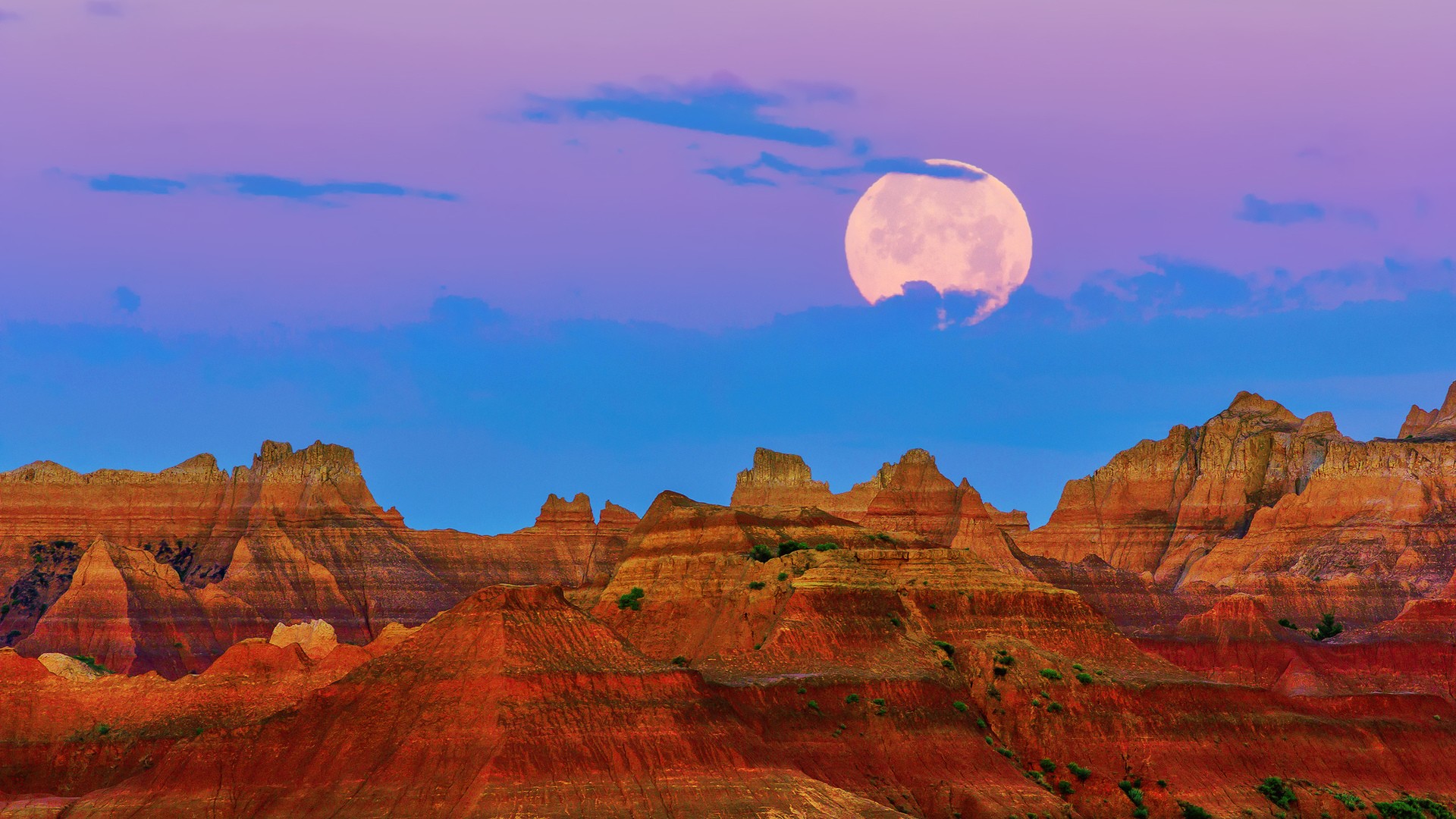Full moon over Badlands National Park mountains HD Wallpaper