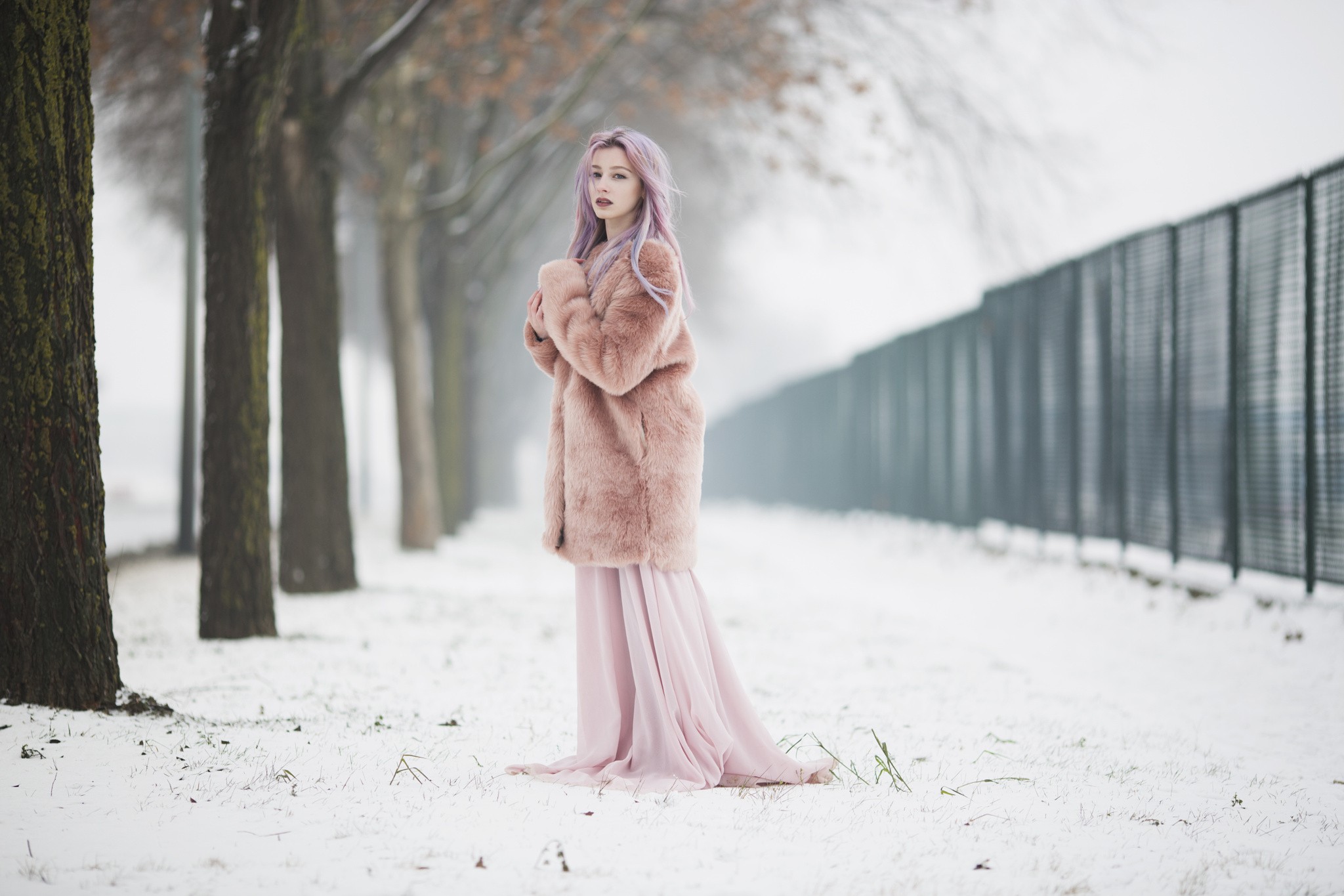 Woman with pink hair in a pink coat in the snow HD Wallpaper