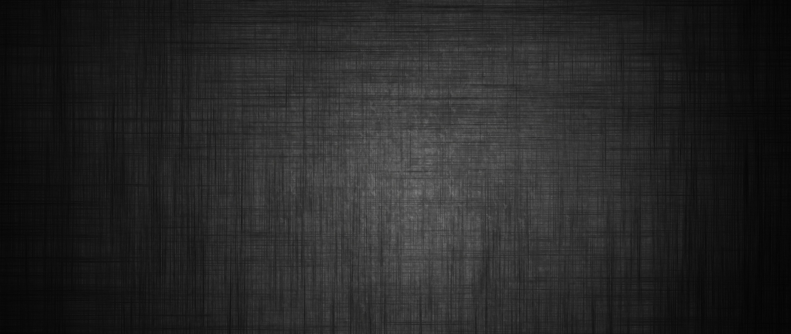 Dark textured surface with subtle lighting HD Wallpaper