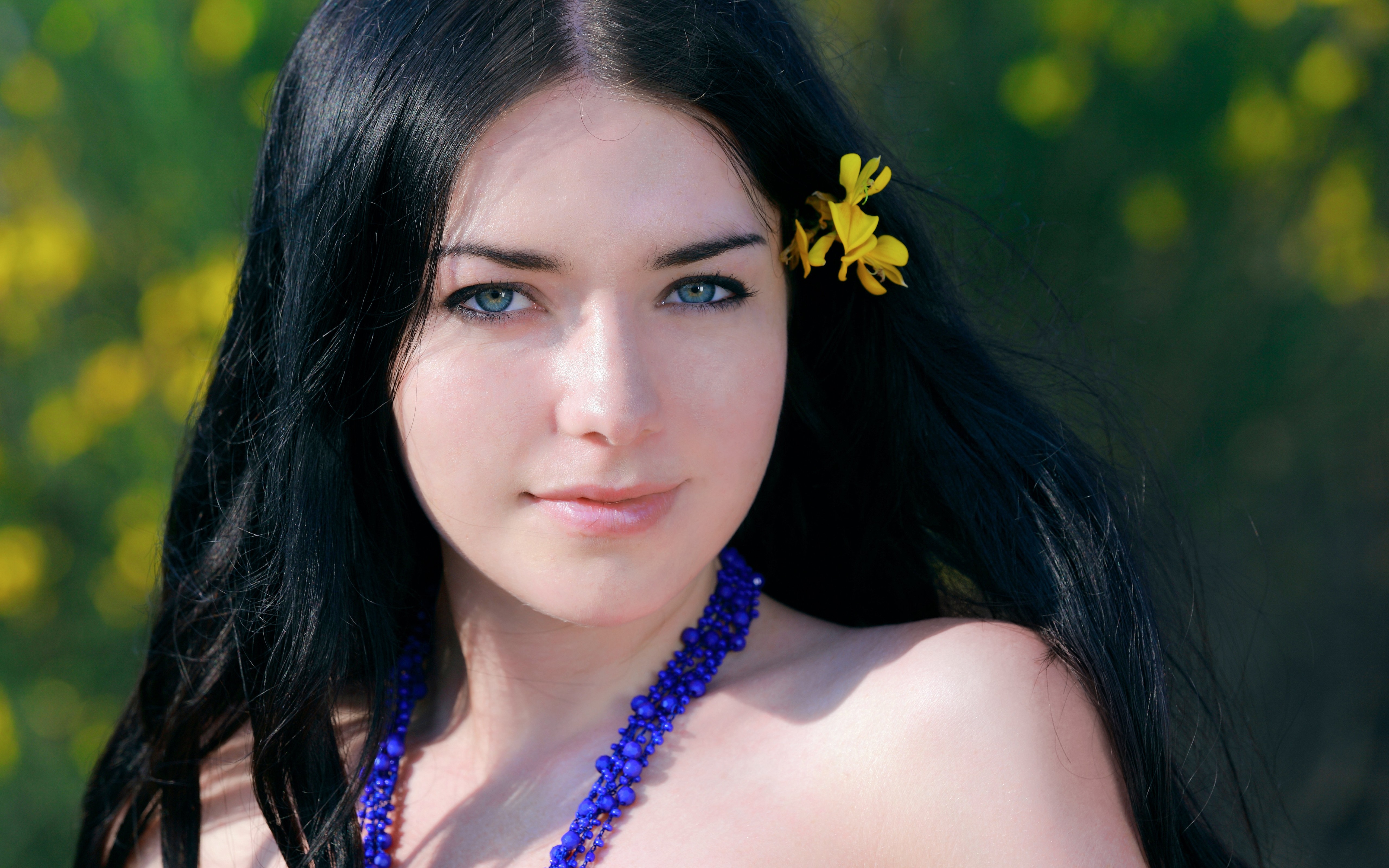 Woman with black hair and blue eyes outdoors HD Wallpaper