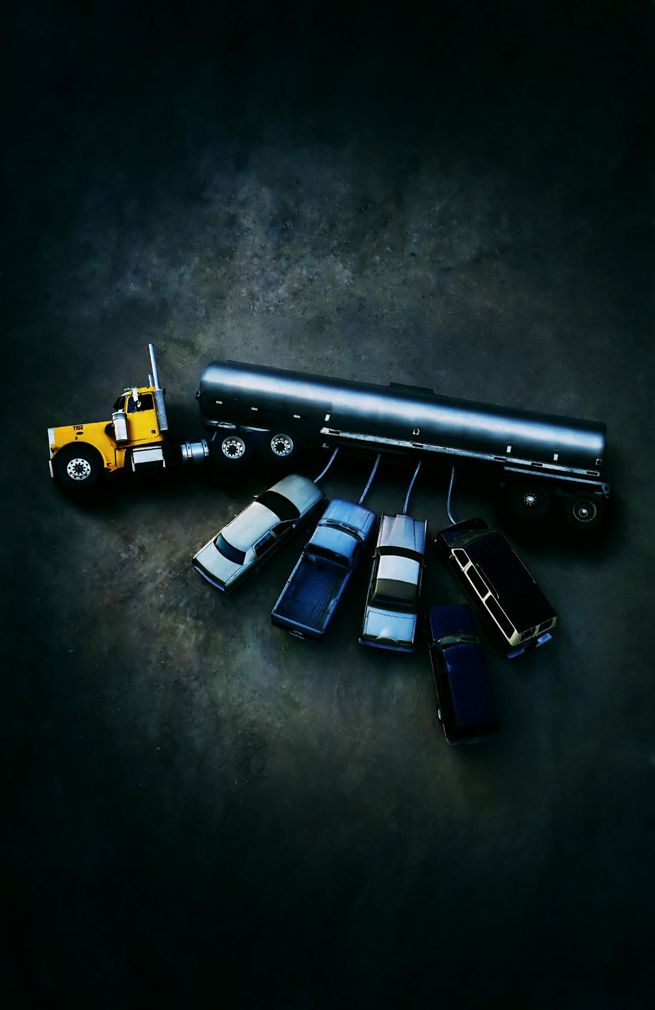 Yellow truck and tanker trailer with cars HD Wallpaper