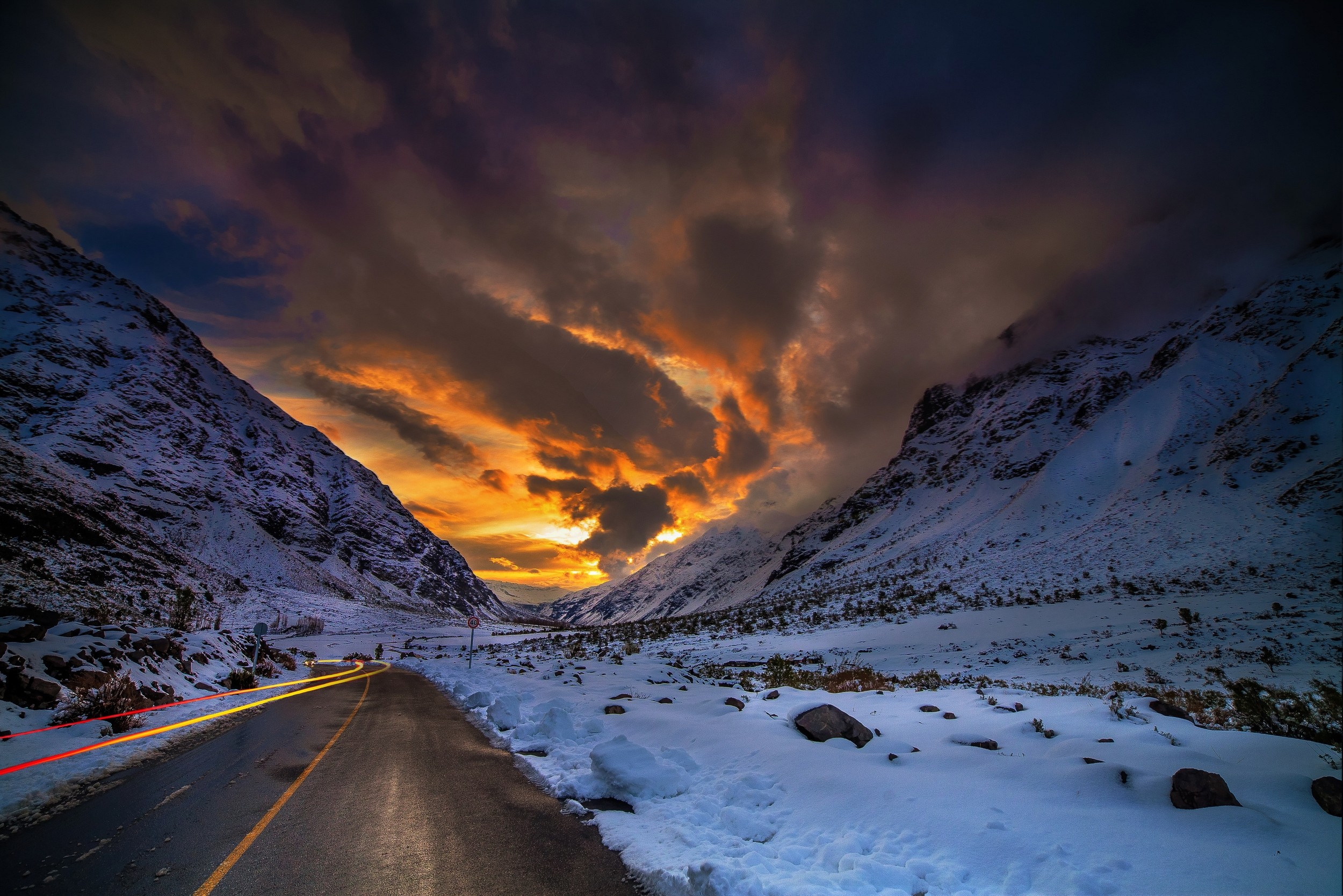 Sunset over snowy mountains and road in Chile HD Wallpaper