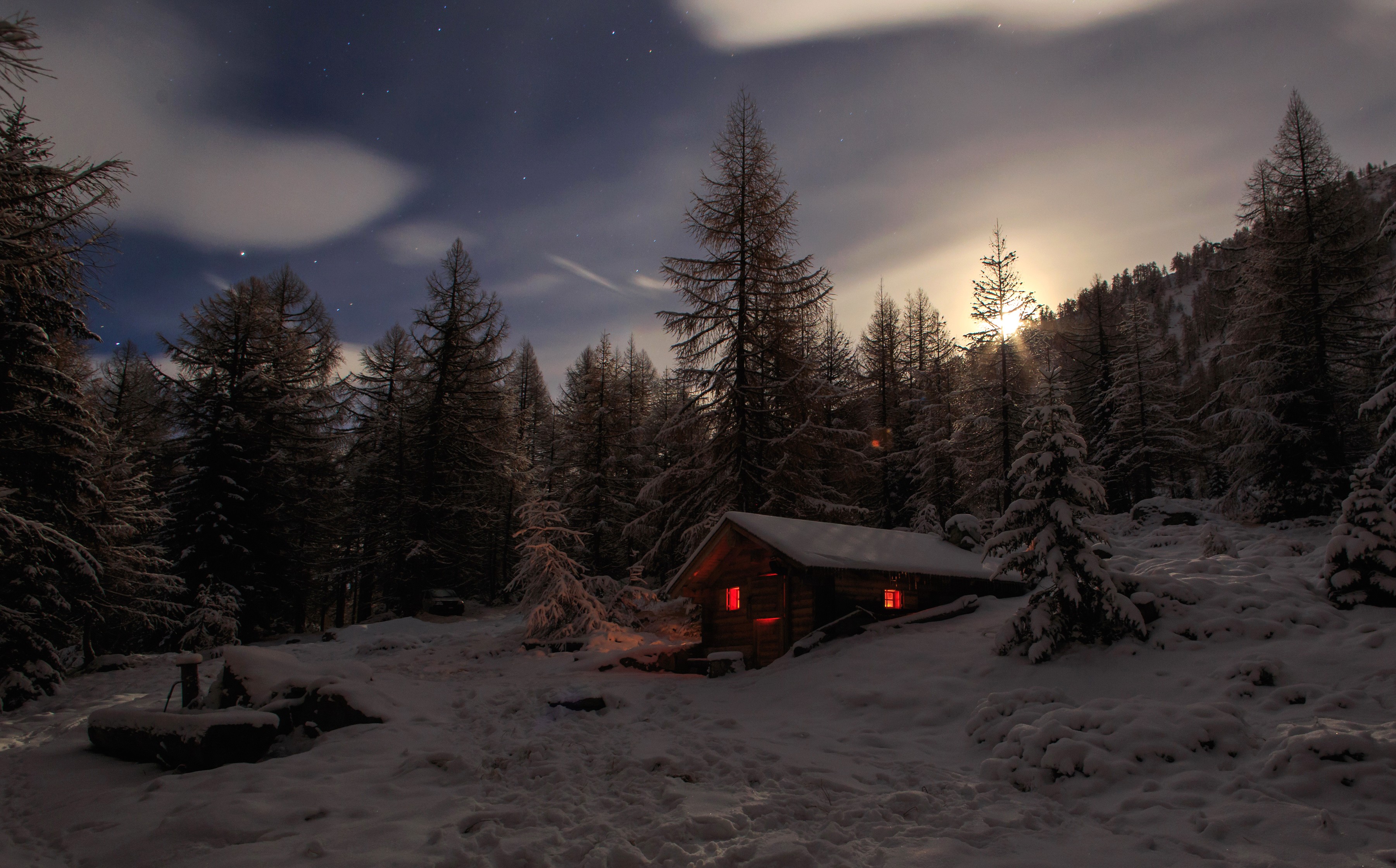 Winter cabin in a snowy forest at night HD Wallpaper