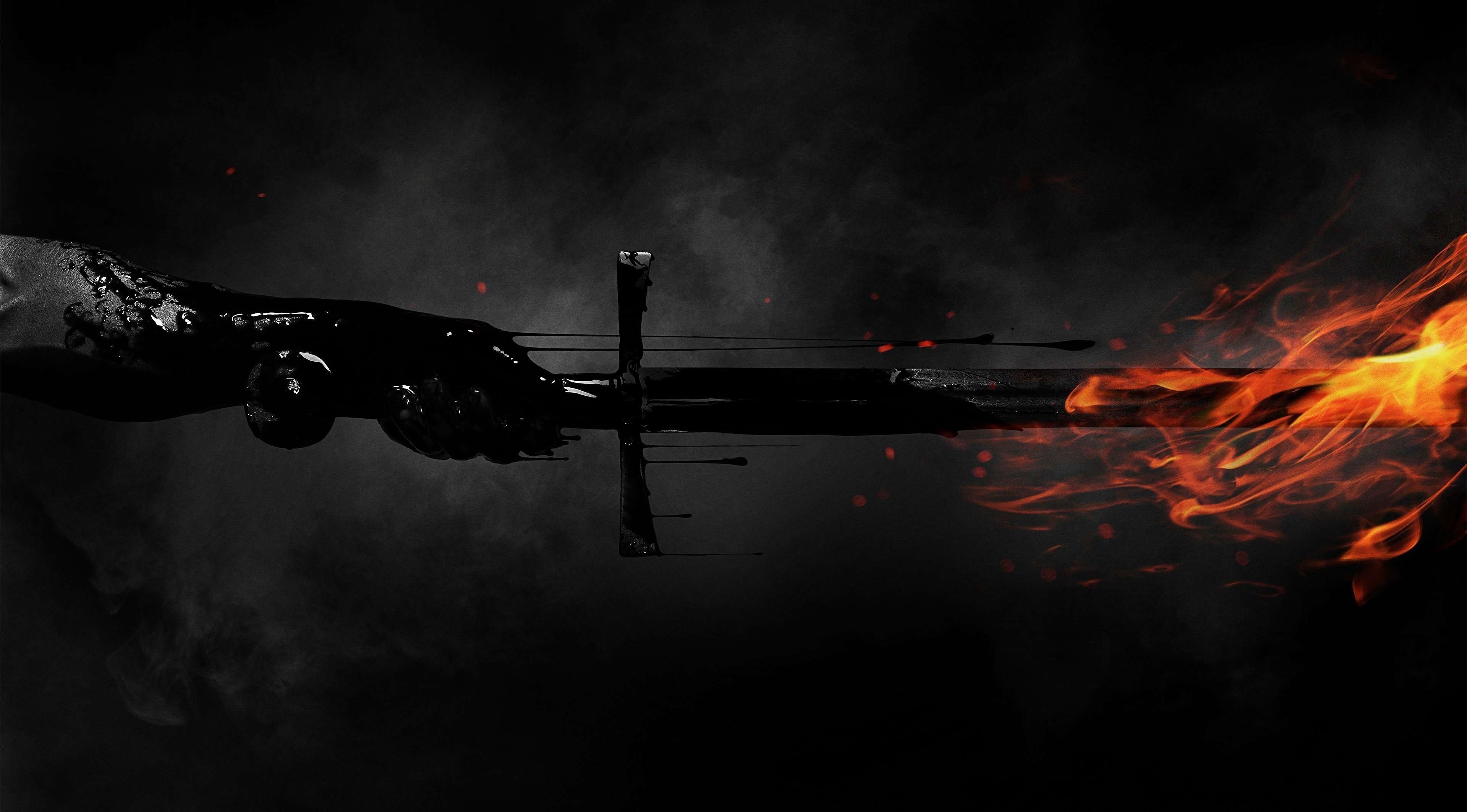 A hand holding a flaming sword HD Wallpaper