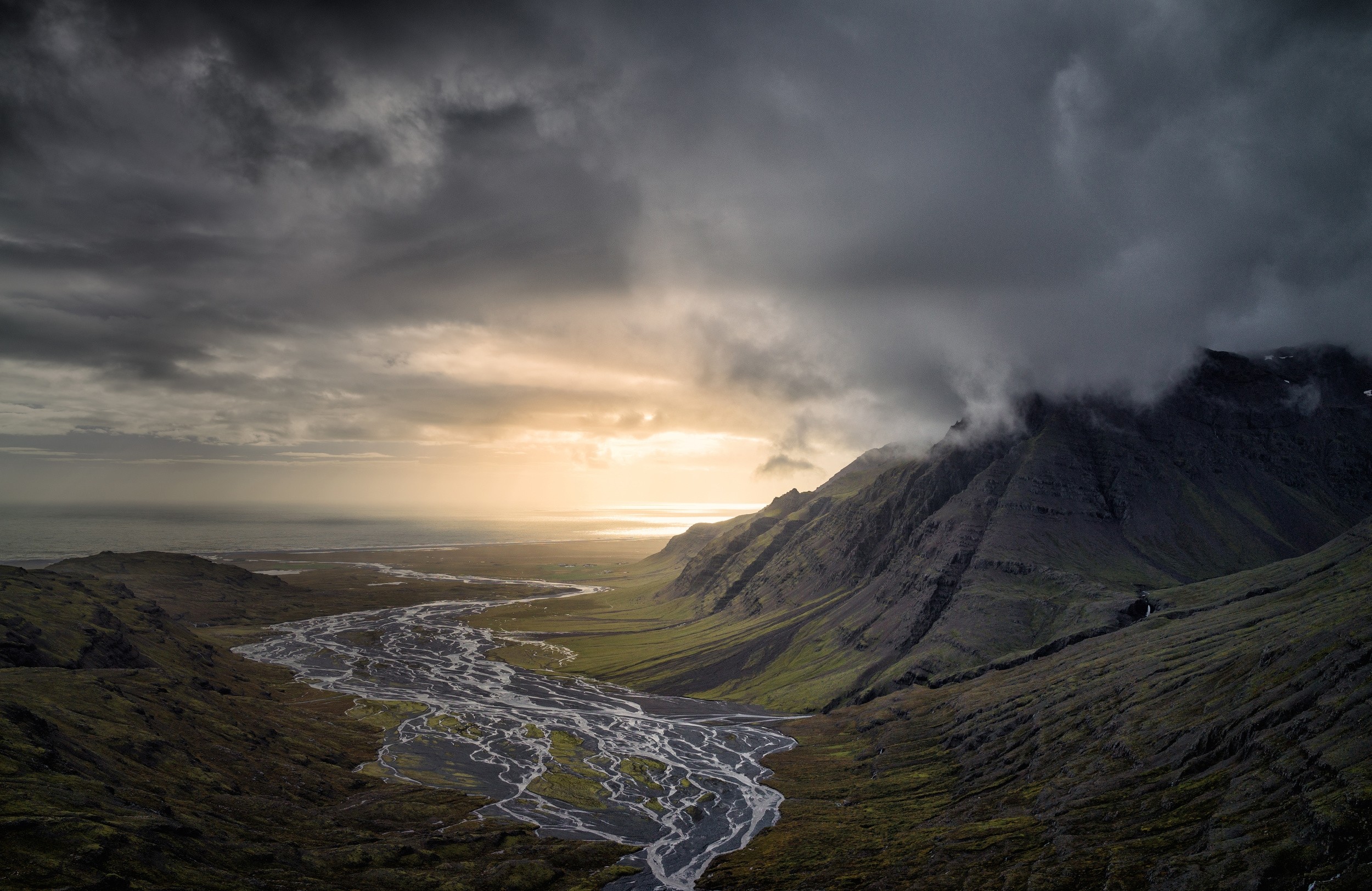 River valley in Iceland under dramatic clouds at sunset HD Wallpaper