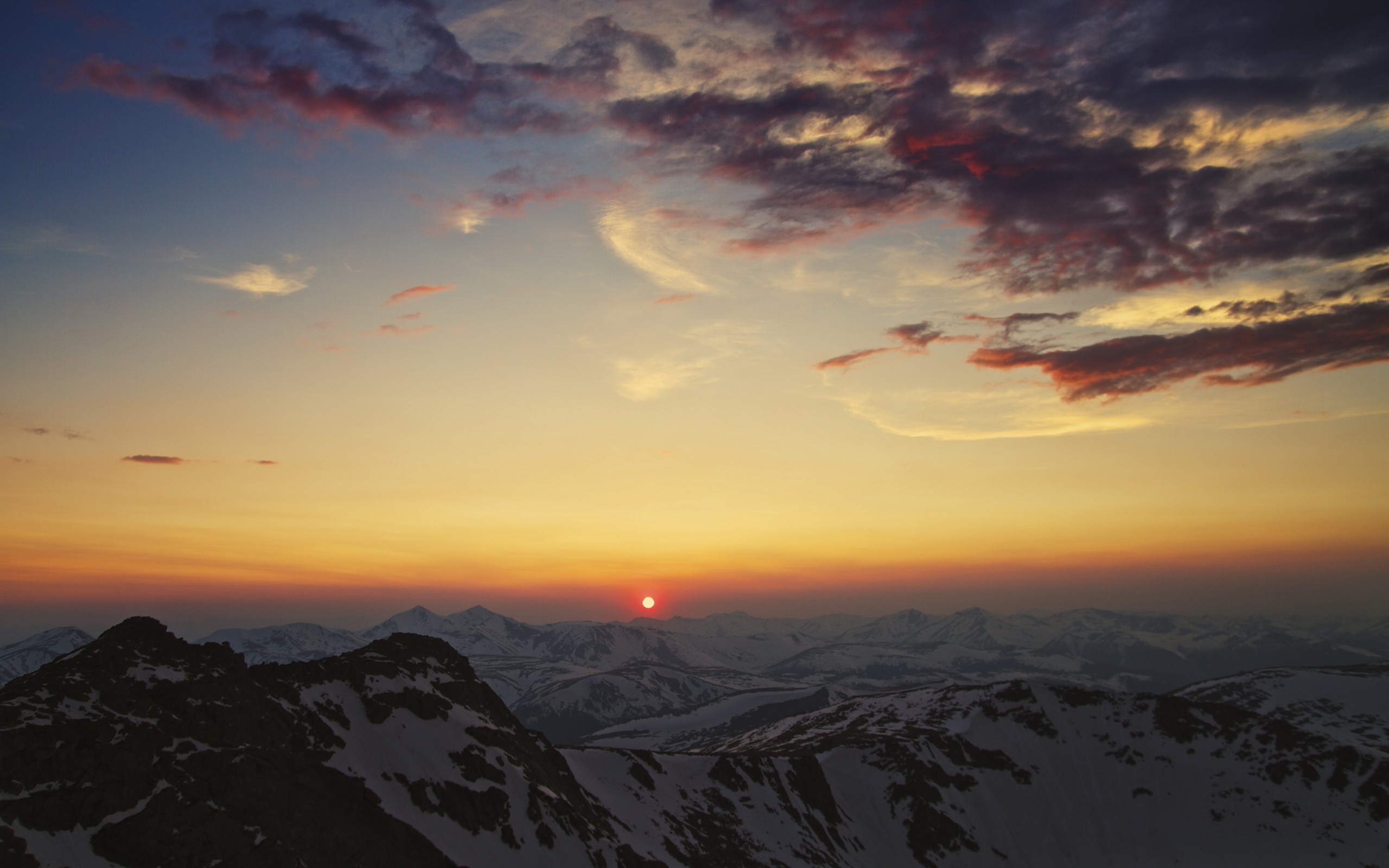 Sunset over snow-capped mountains HD Wallpaper