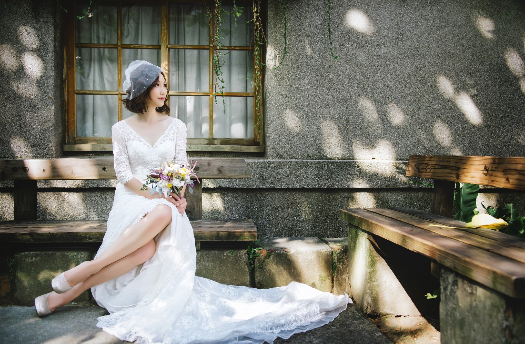 Asian bride in a white dress holding a bouquet HD Wallpaper